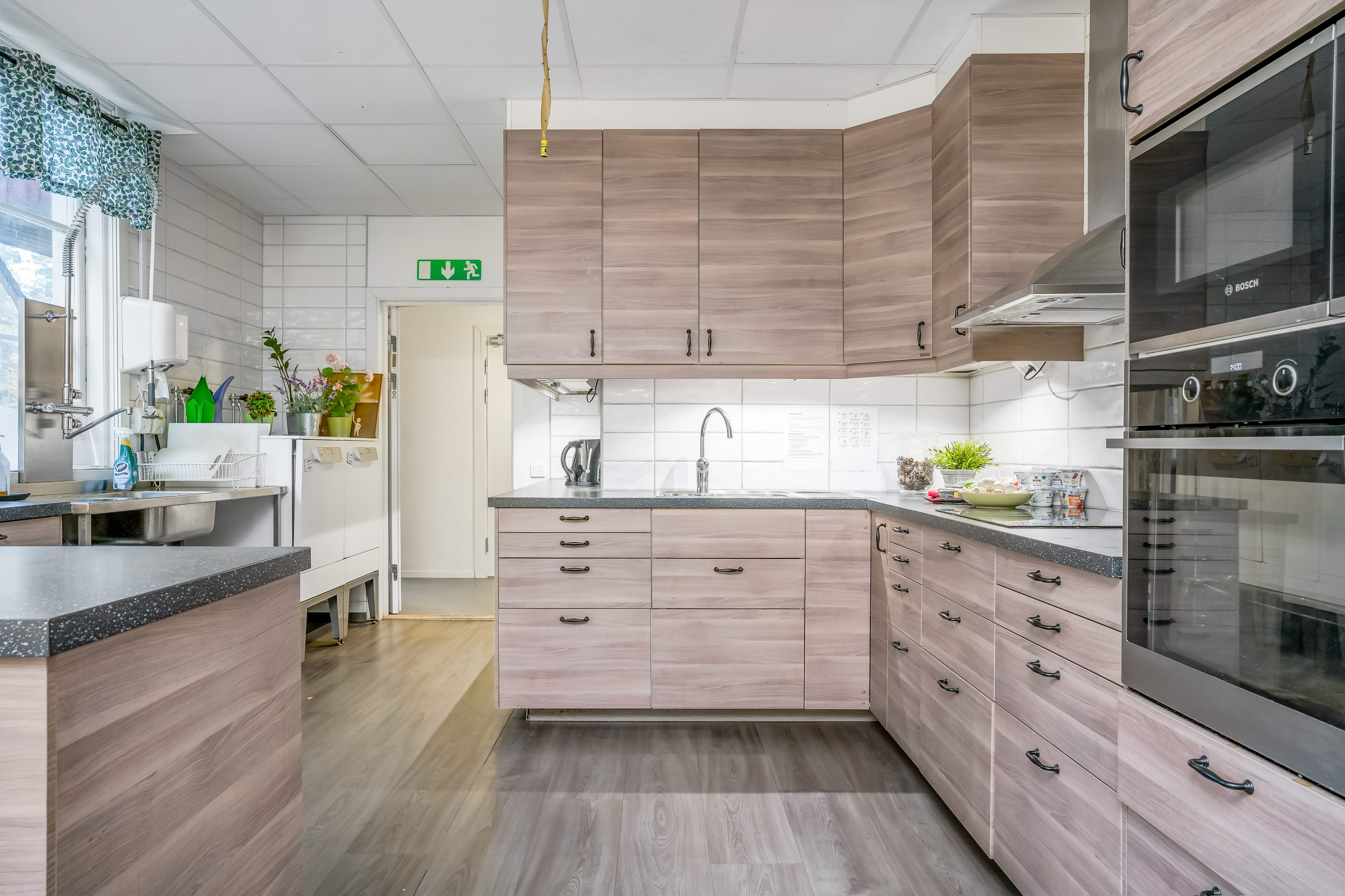 A large kitchen with stainless steel appliances