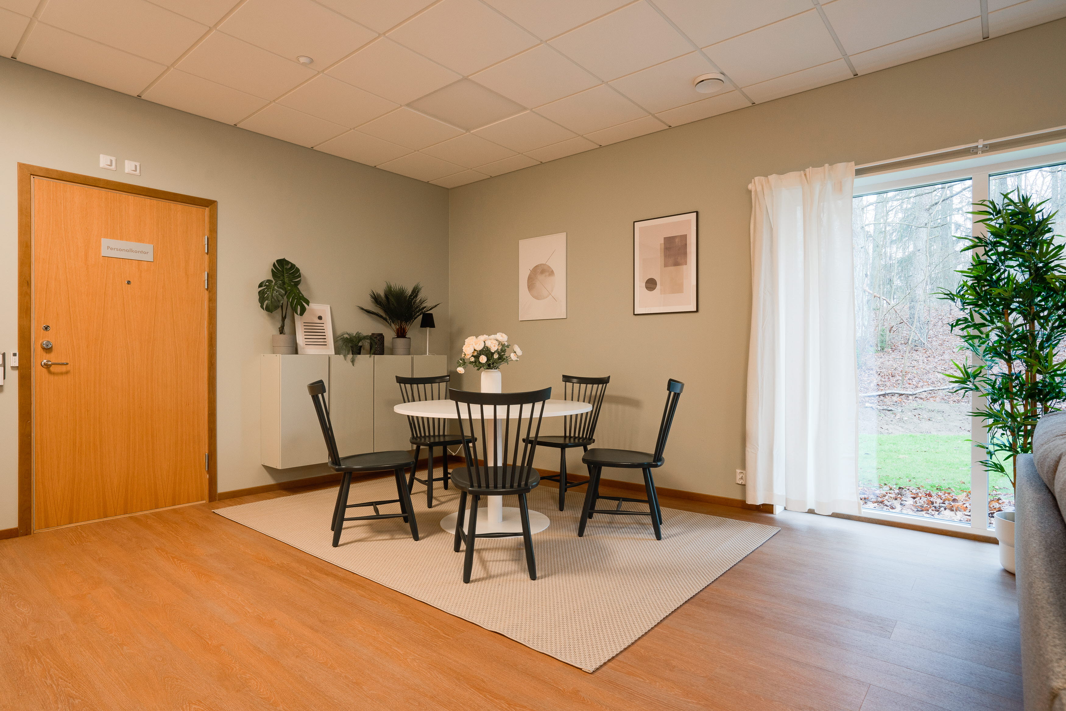 A living room filled with furniture on top of a hard wood floor