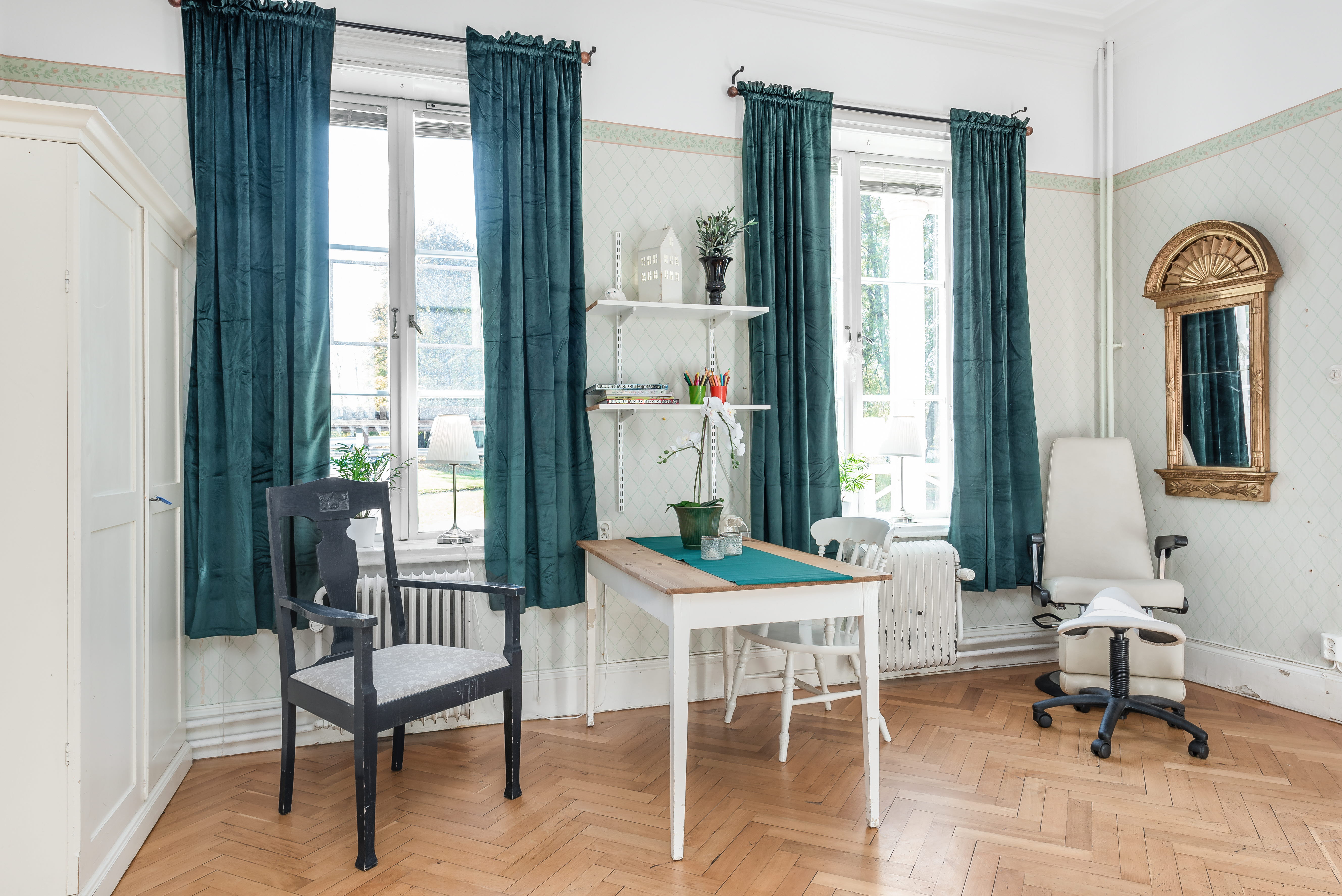 A living room filled with furniture and a large window