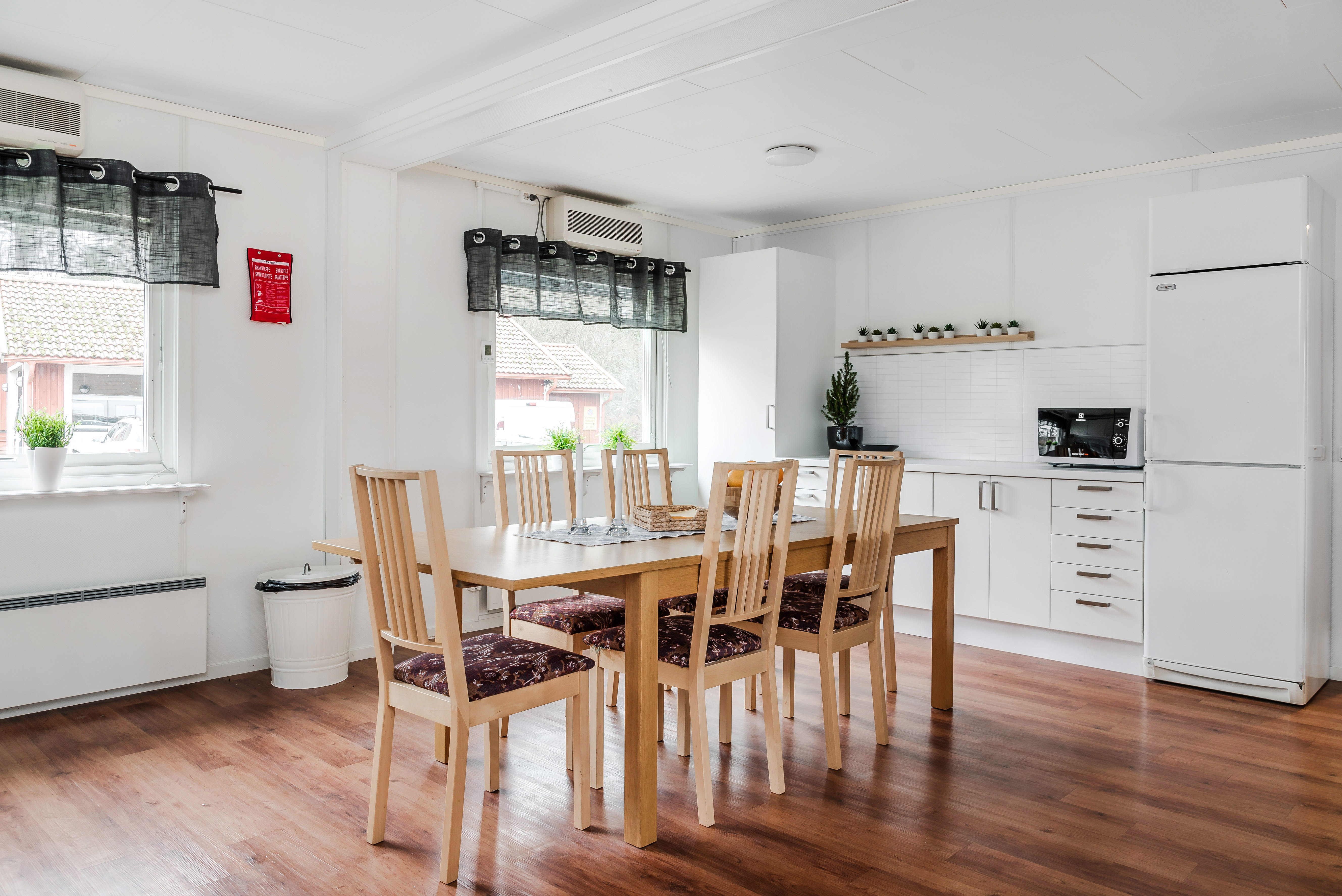 A room filled with furniture and a wood floor