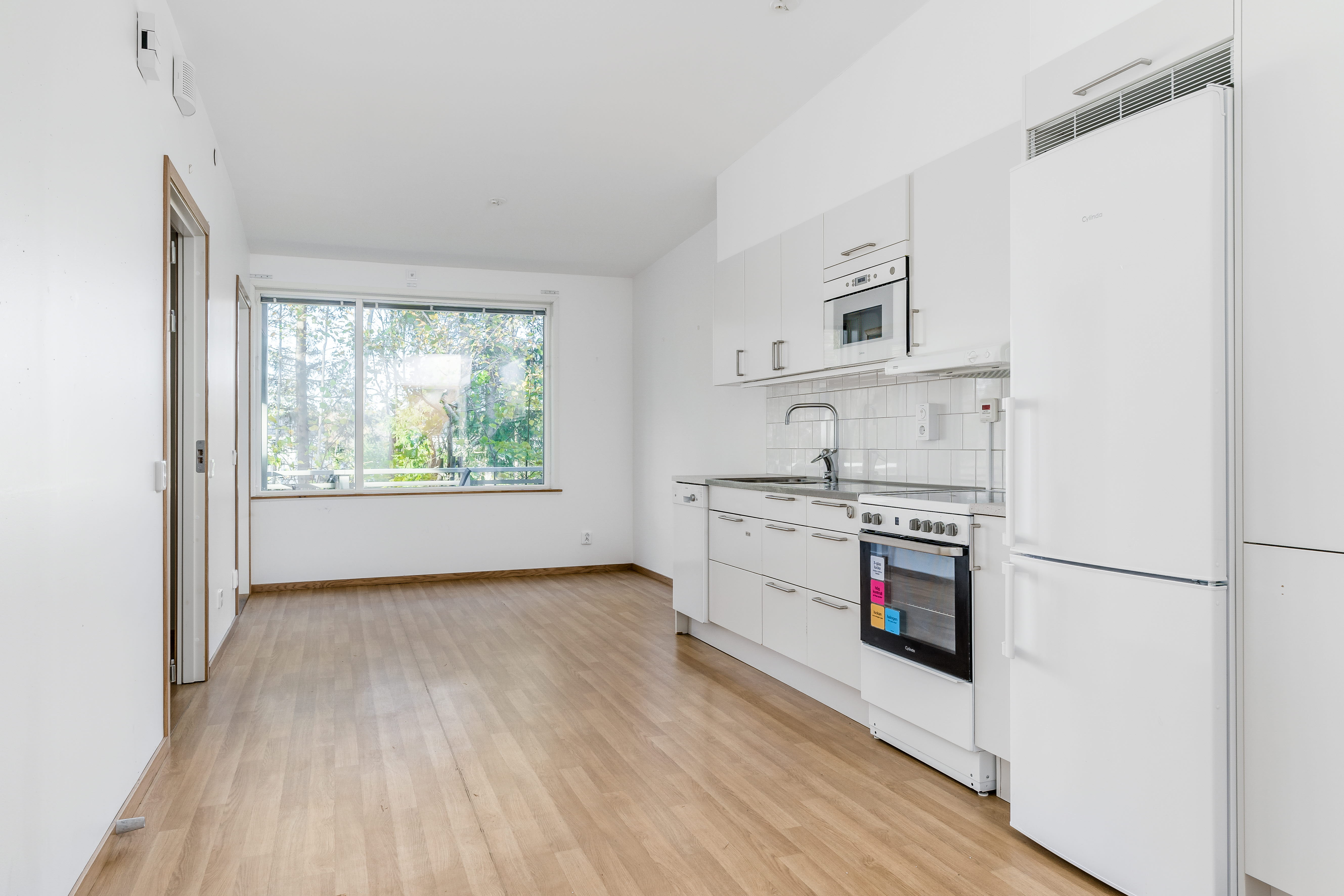 A kitchen with a wood floor