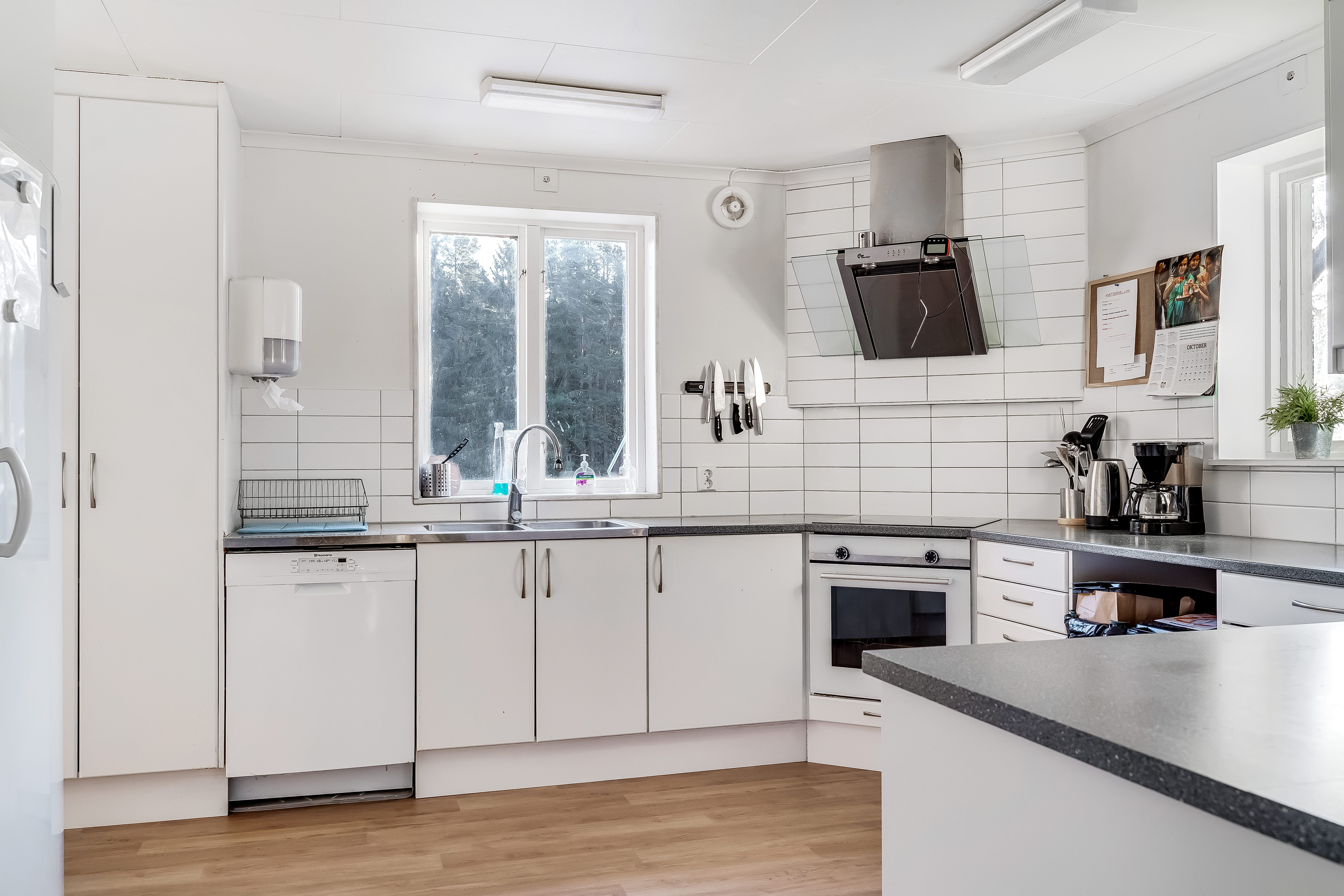 A kitchen with a sink and a window