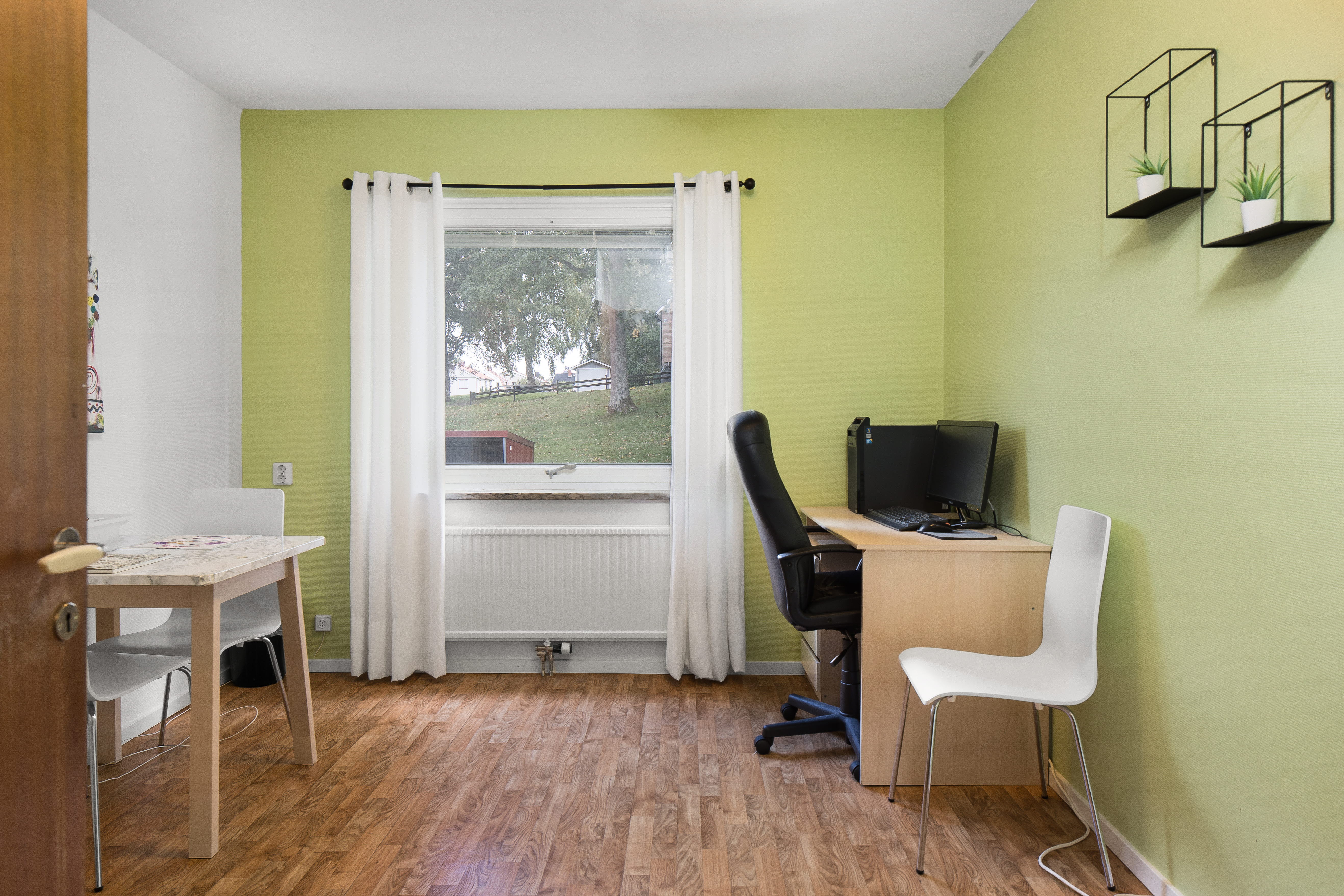 A living room filled with furniture and a window
