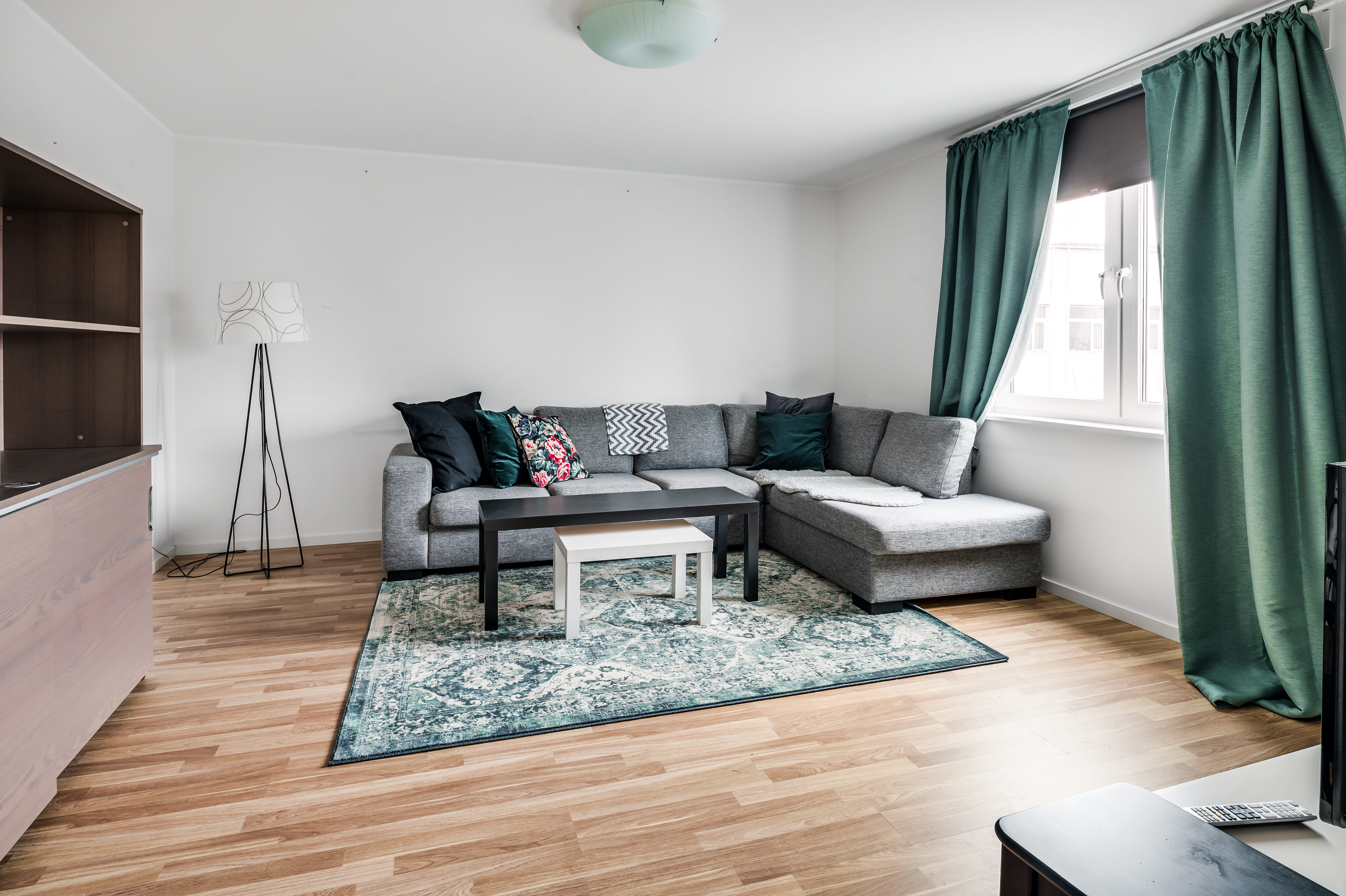 A living room filled with furniture and a large window