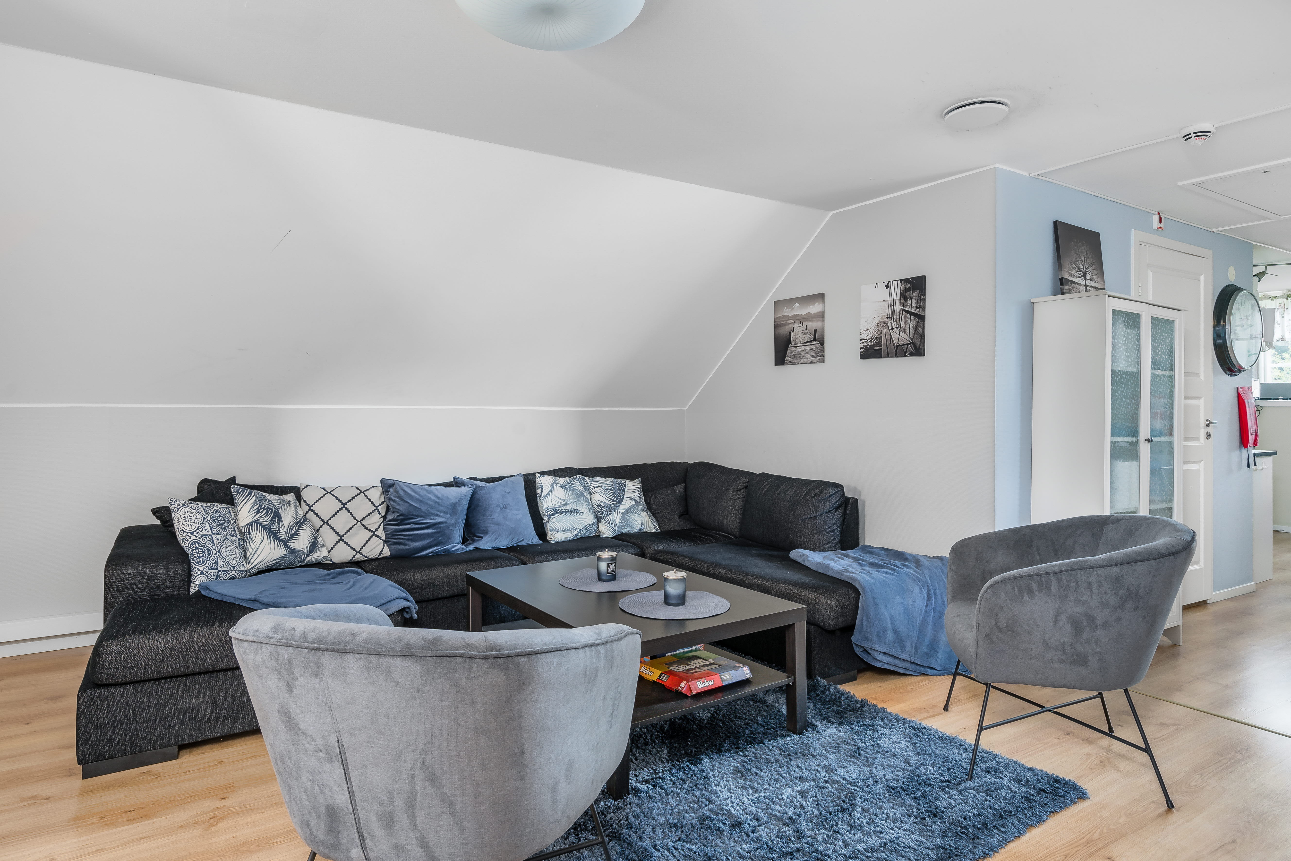 A living room filled with furniture and a fireplace