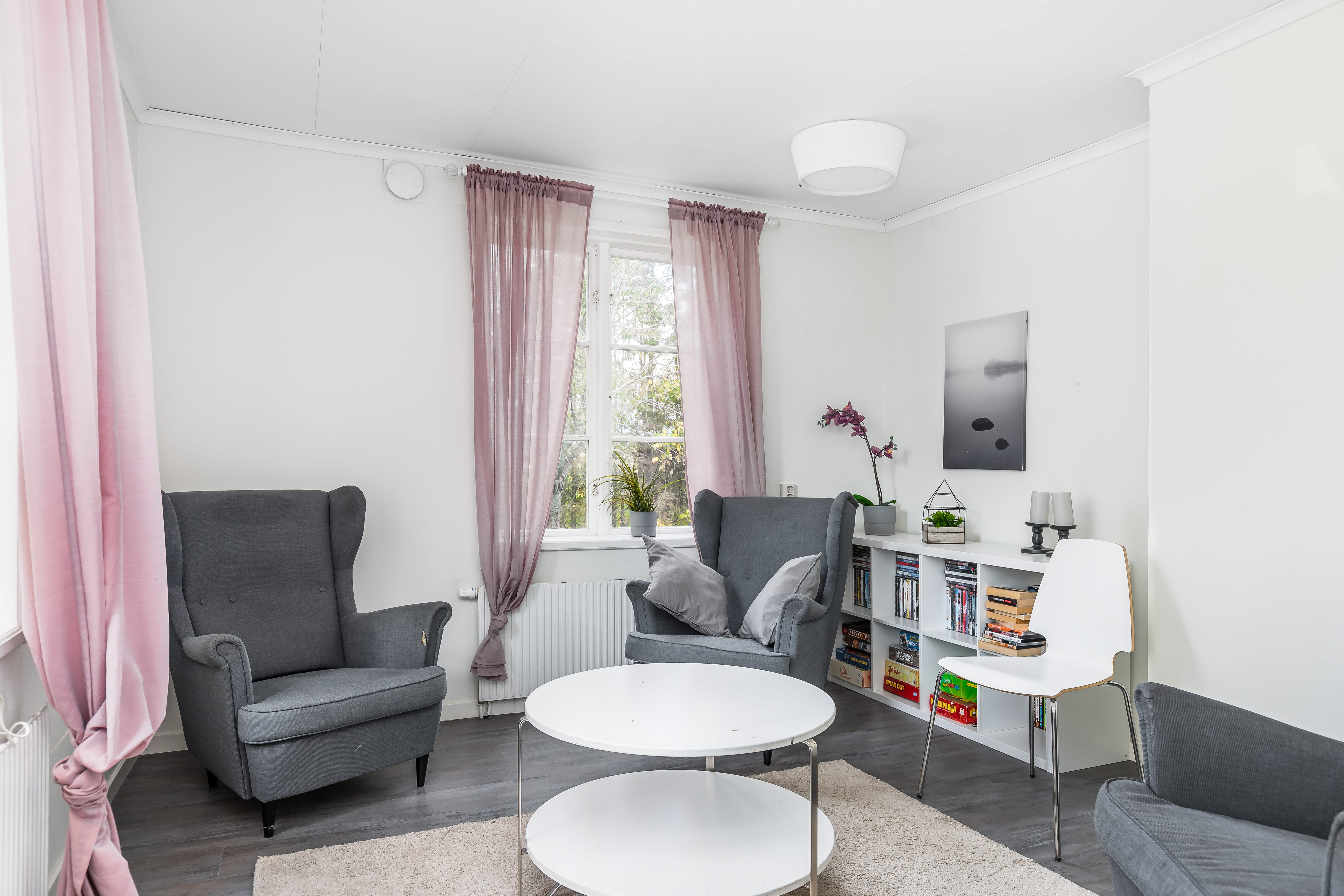 A living room filled with furniture and a window