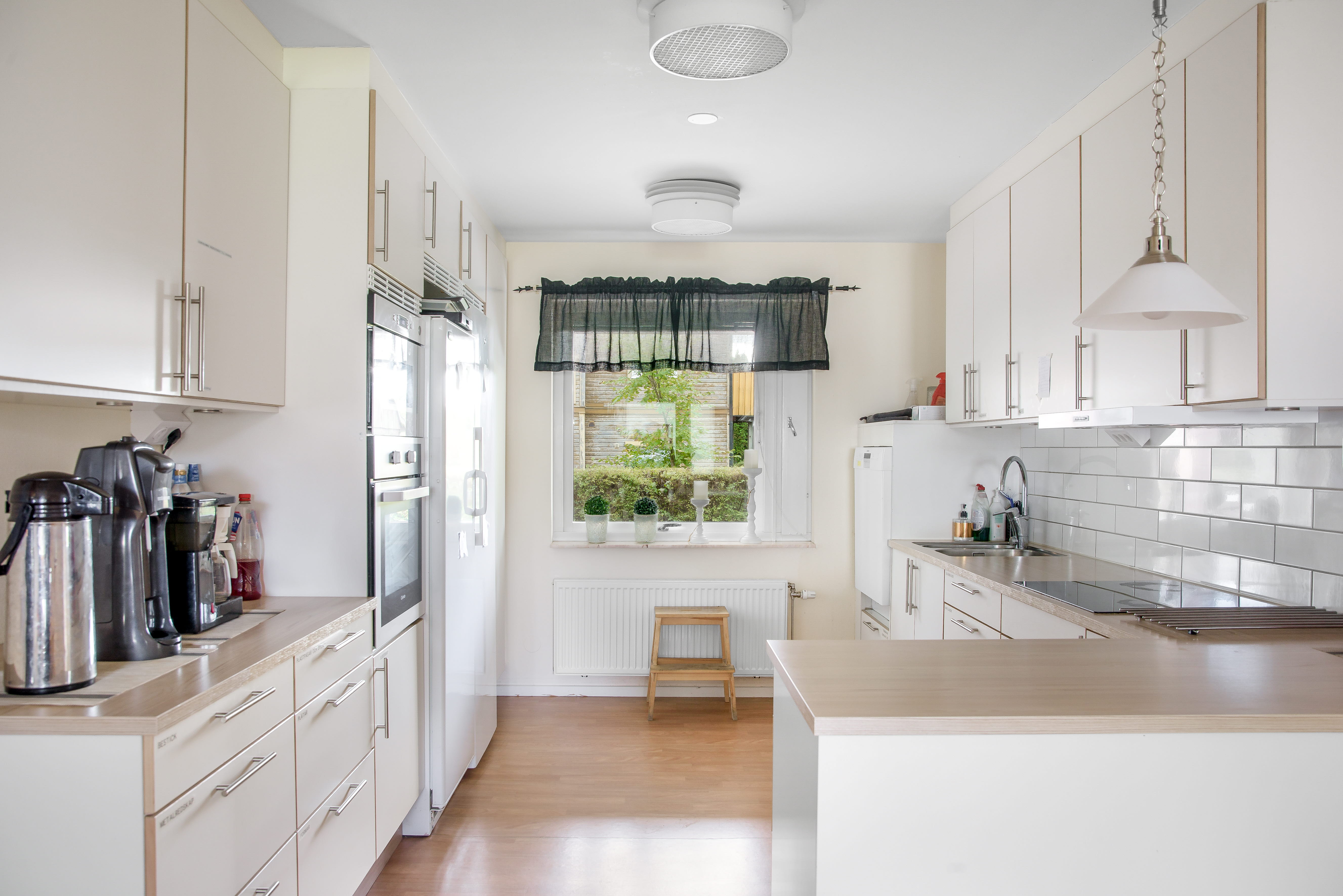 A large kitchen with stainless steel appliances