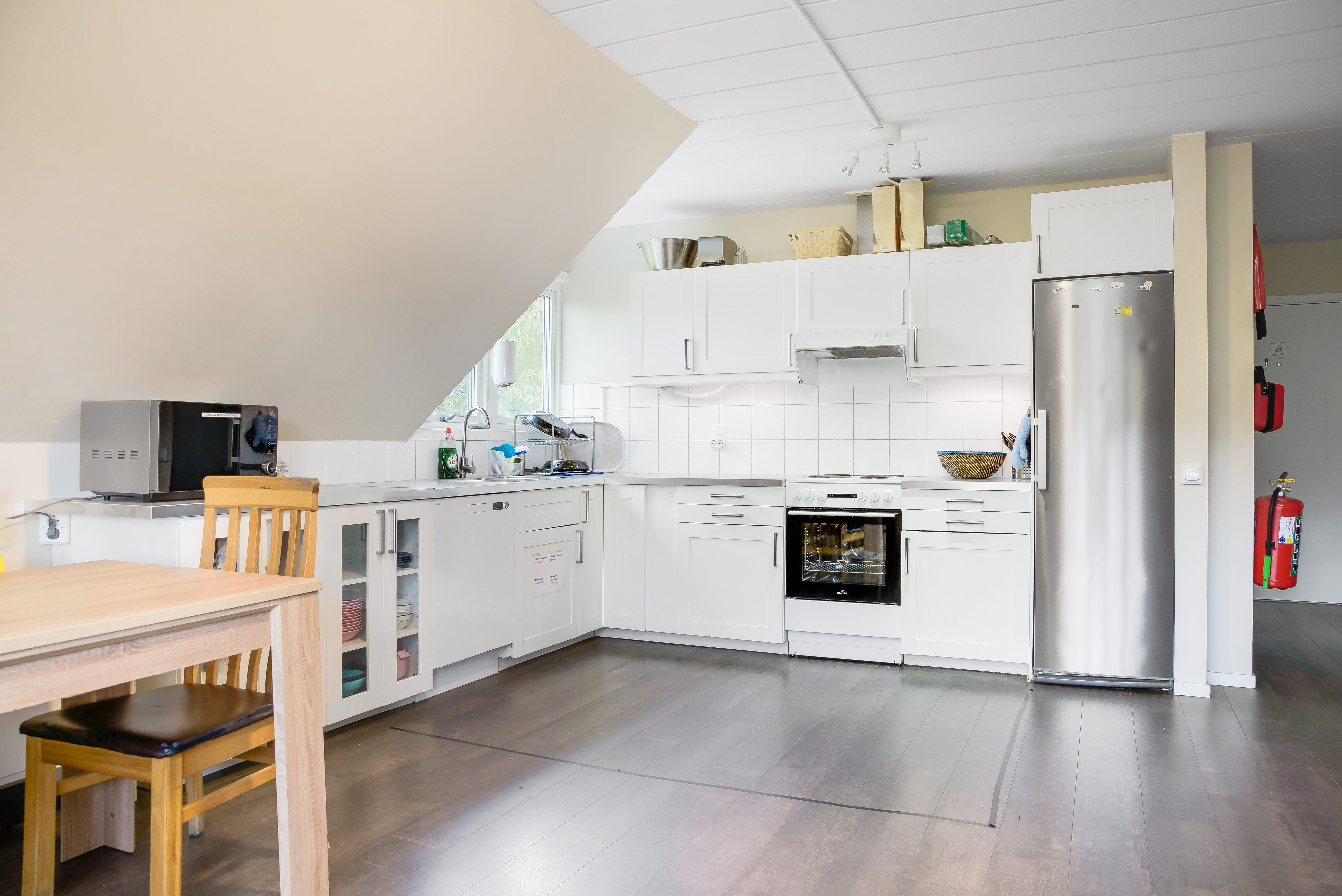 A kitchen with a wood floor