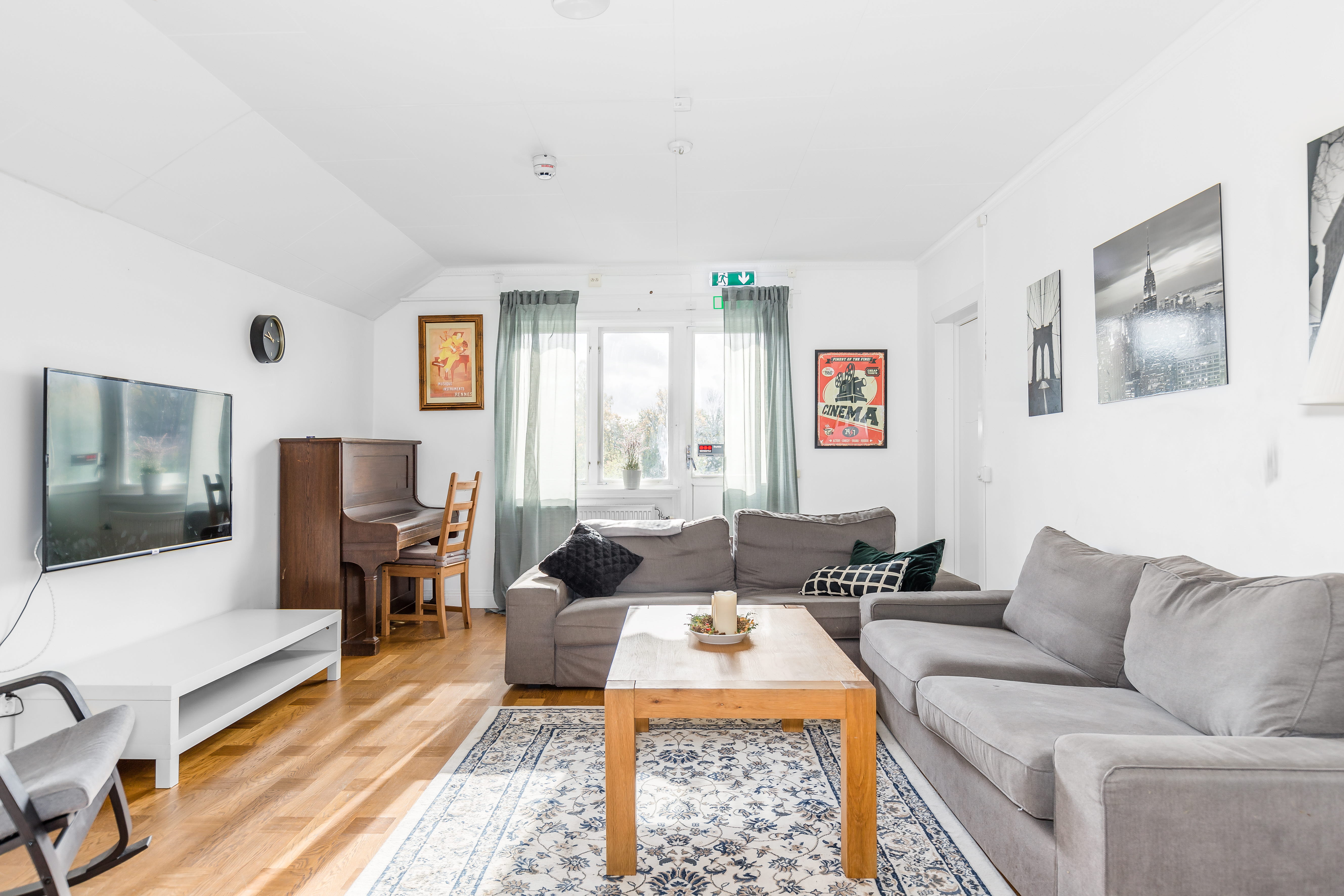 A living room filled with furniture and a flat screen tv