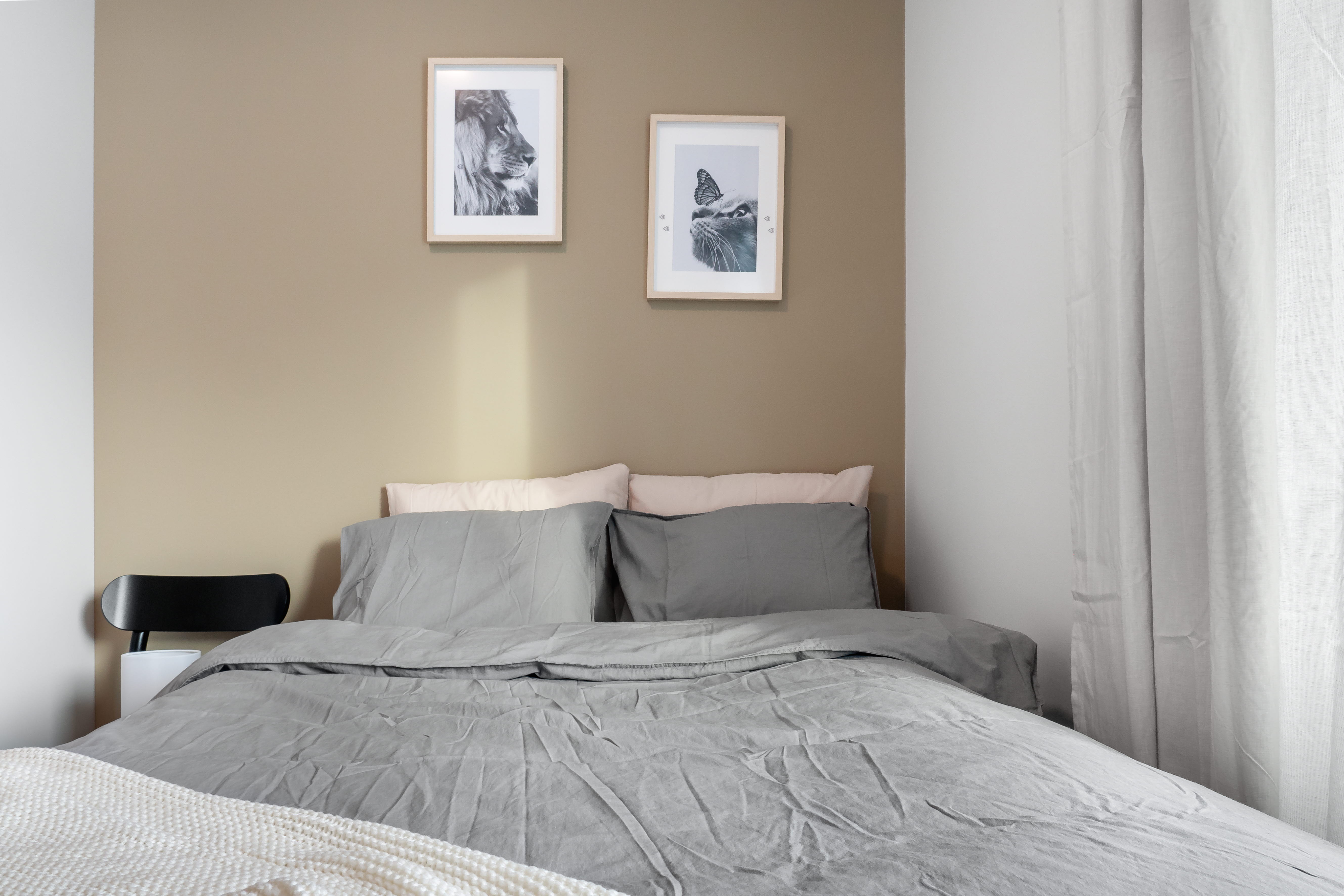 A bedroom with a bed in a room