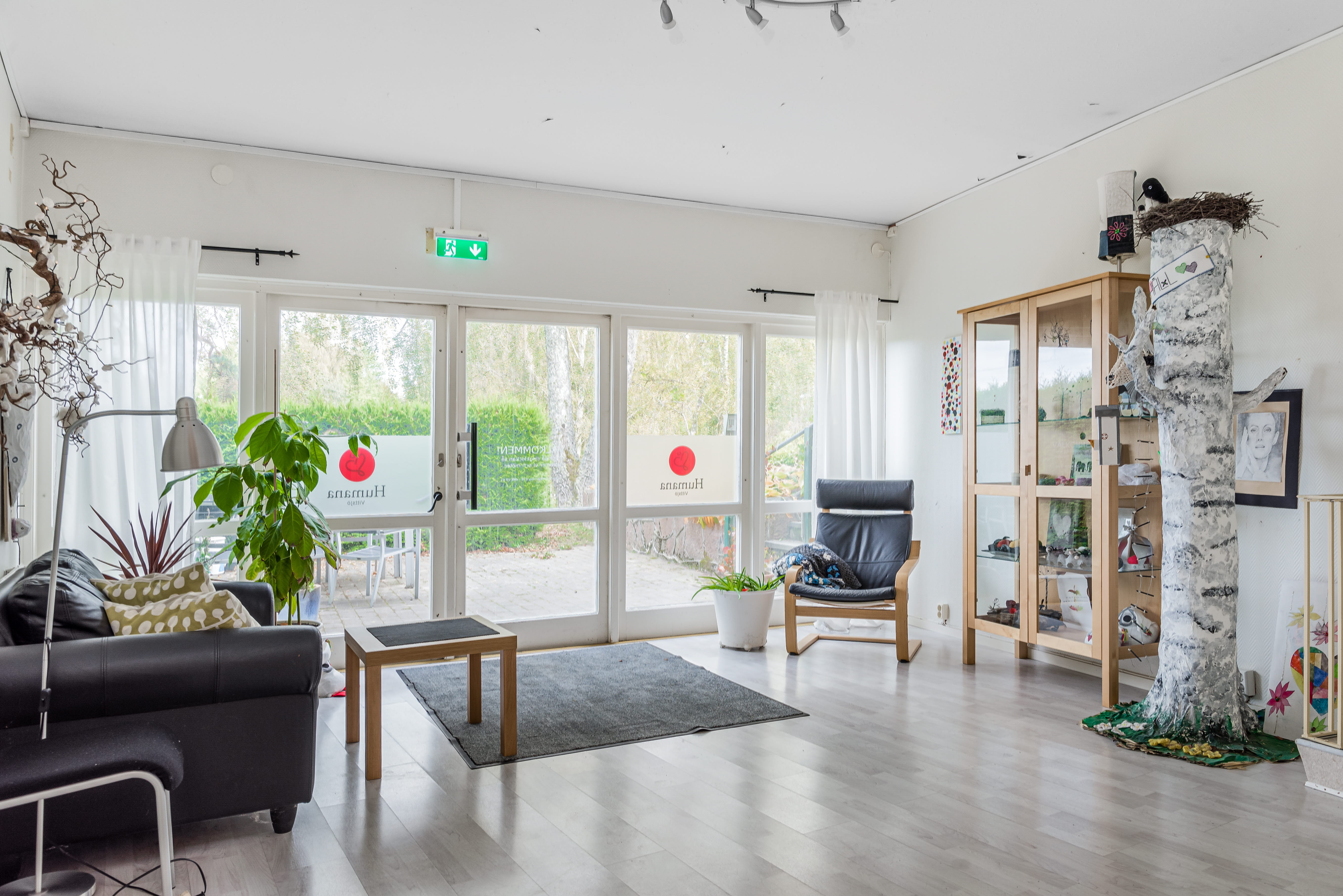A living room filled with furniture and a large window