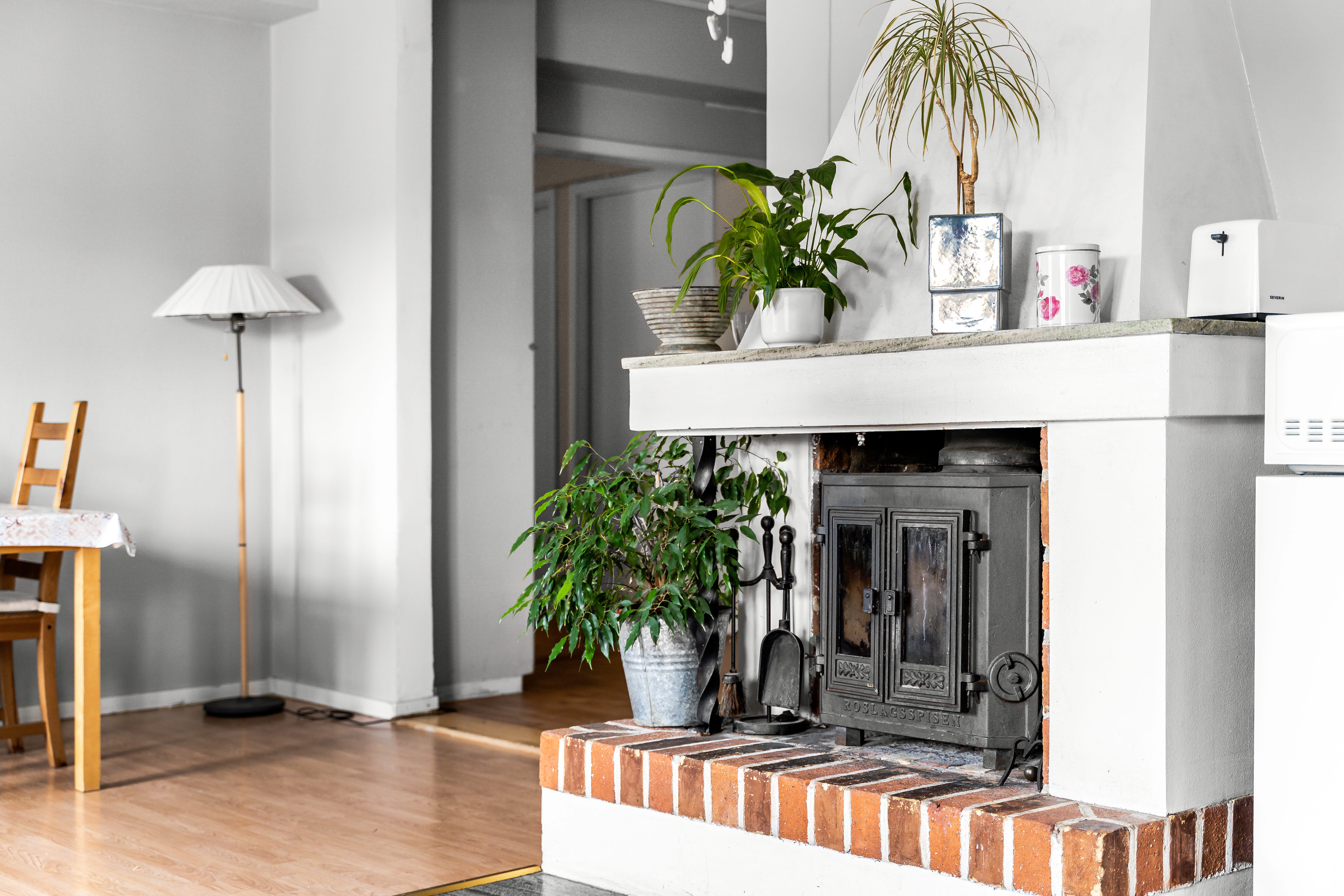 A living room filled with furniture and a fire place