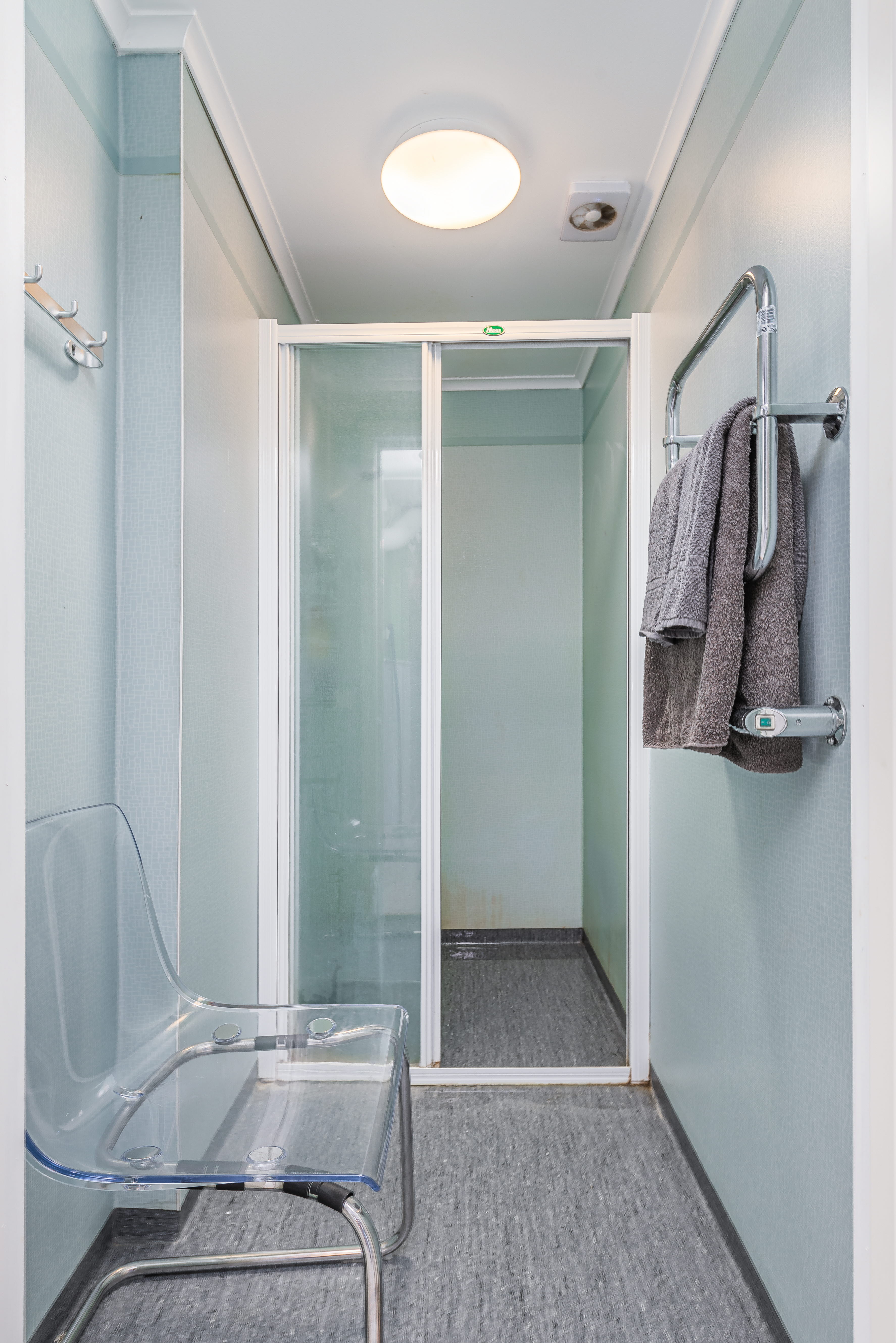 A room with a sink and a shower
