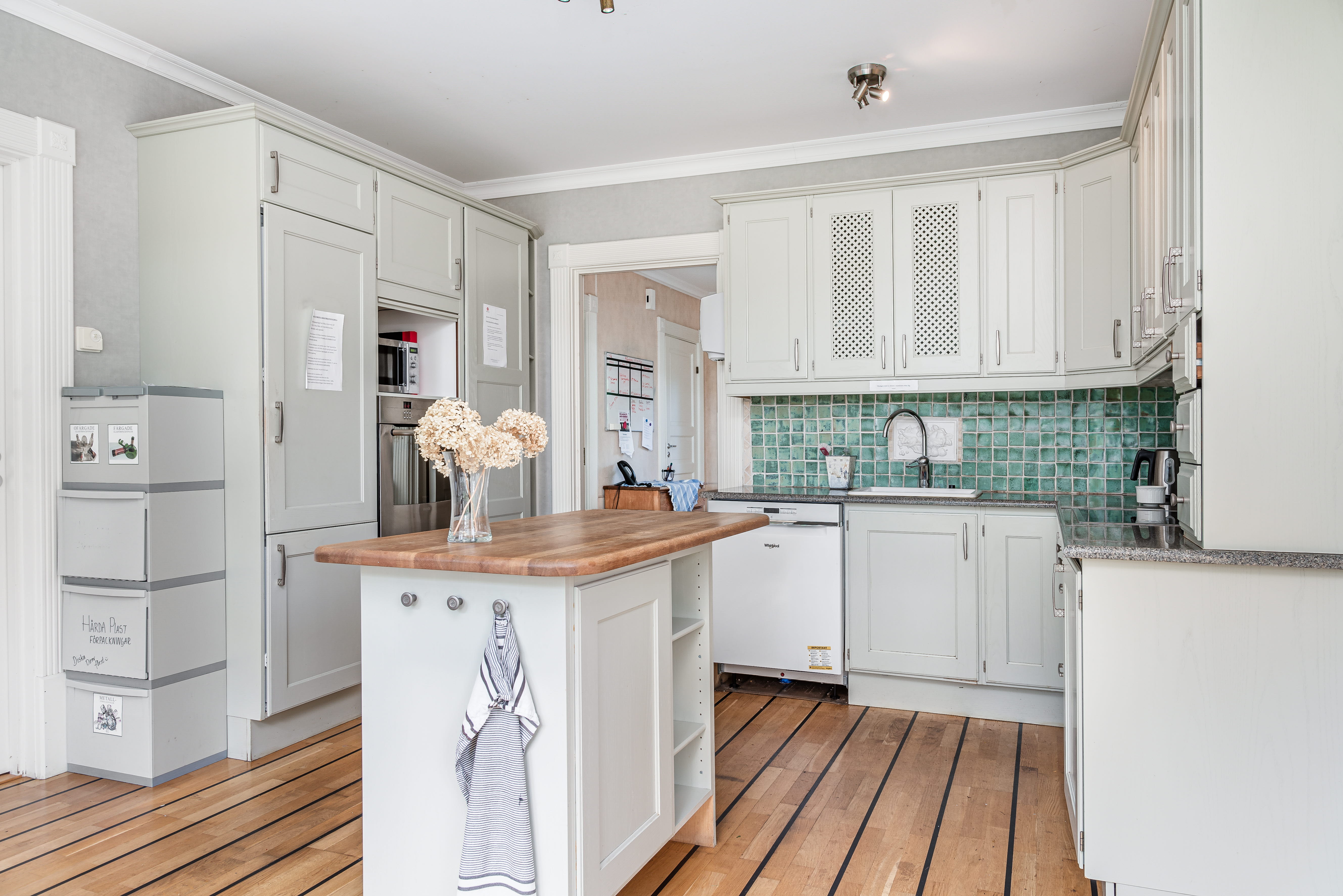 A kitchen with a wood floor