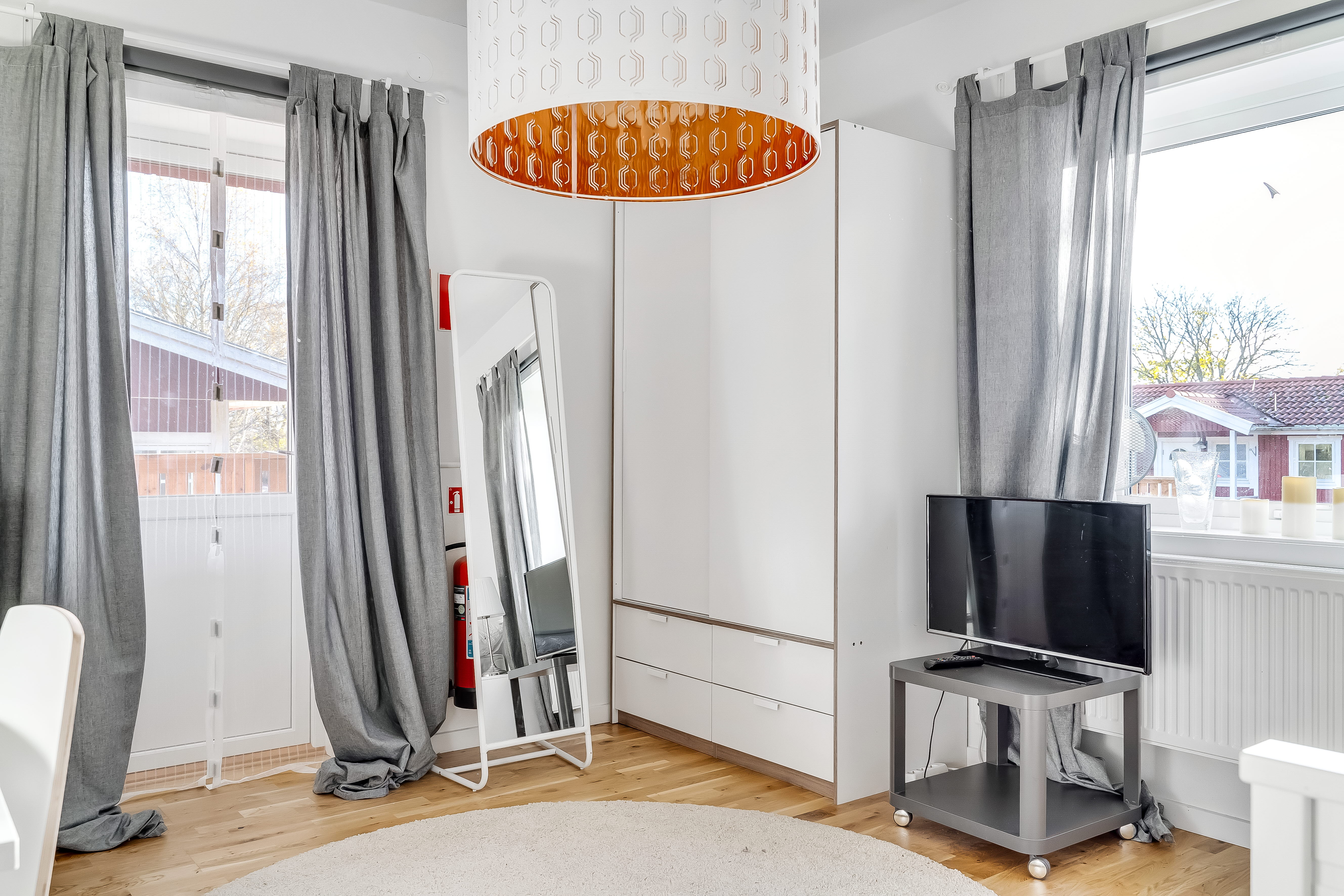 A room filled with furniture and a large window