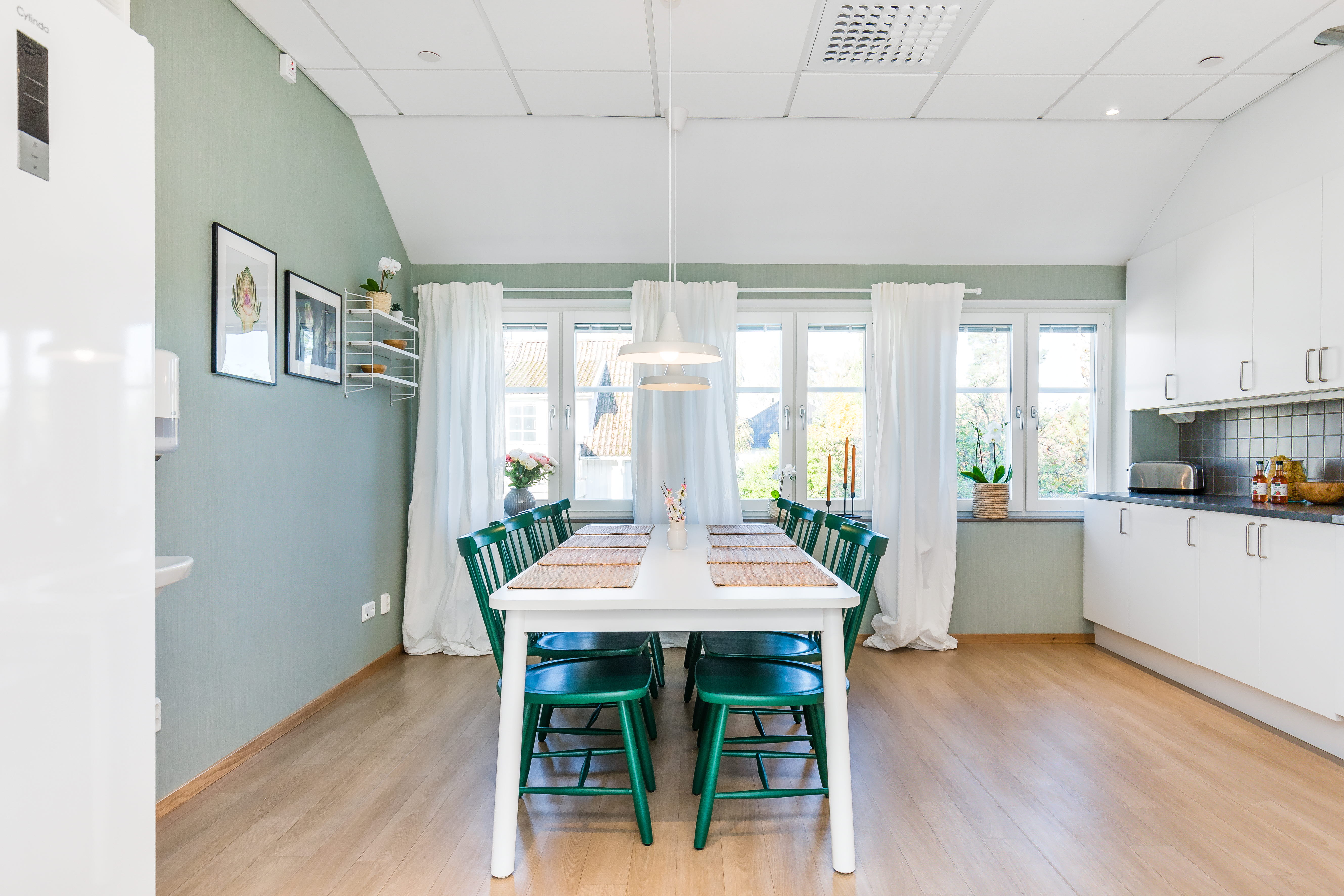 A kitchen with a hard wood floor