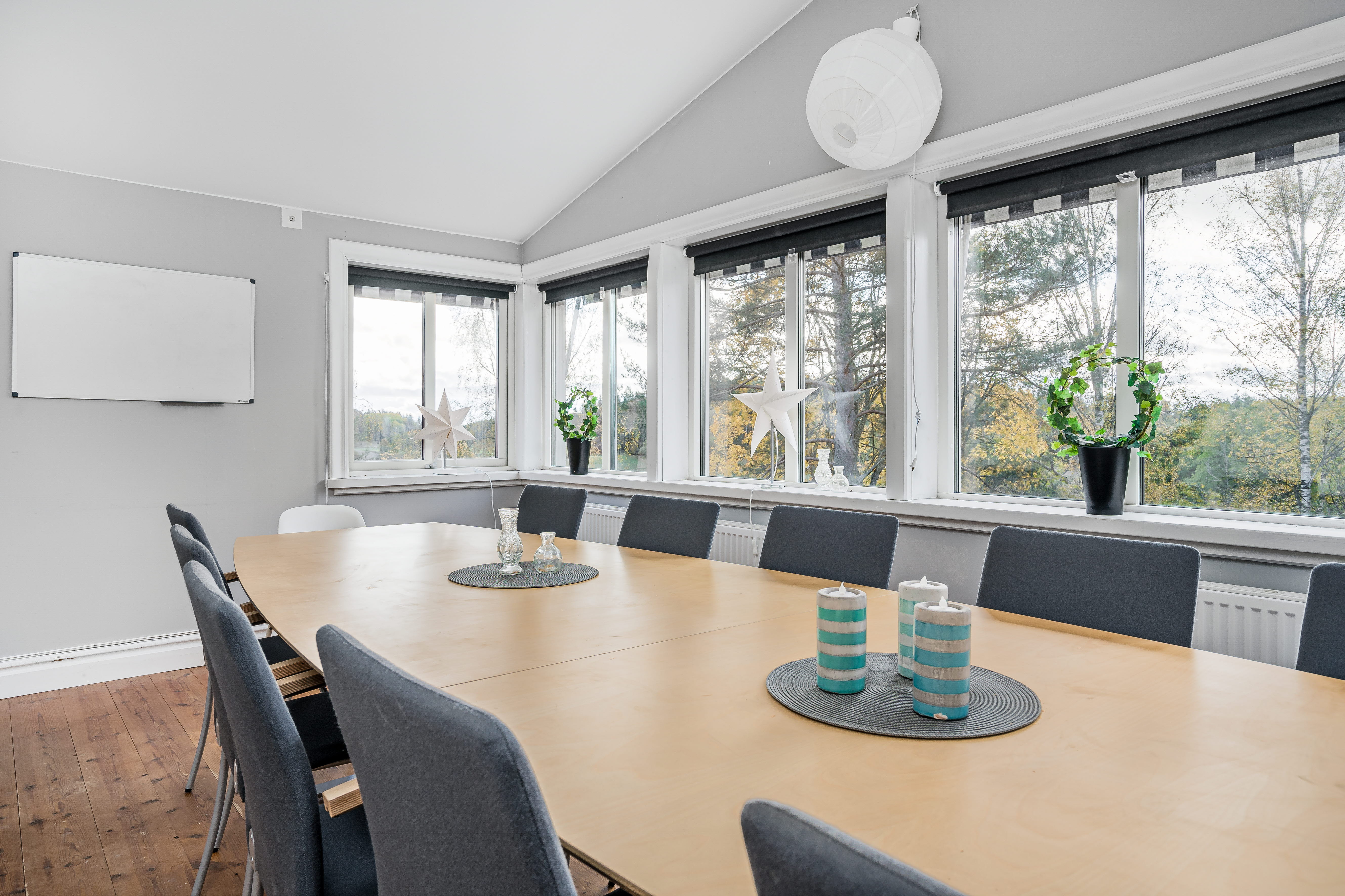A dining room table in front of a window
