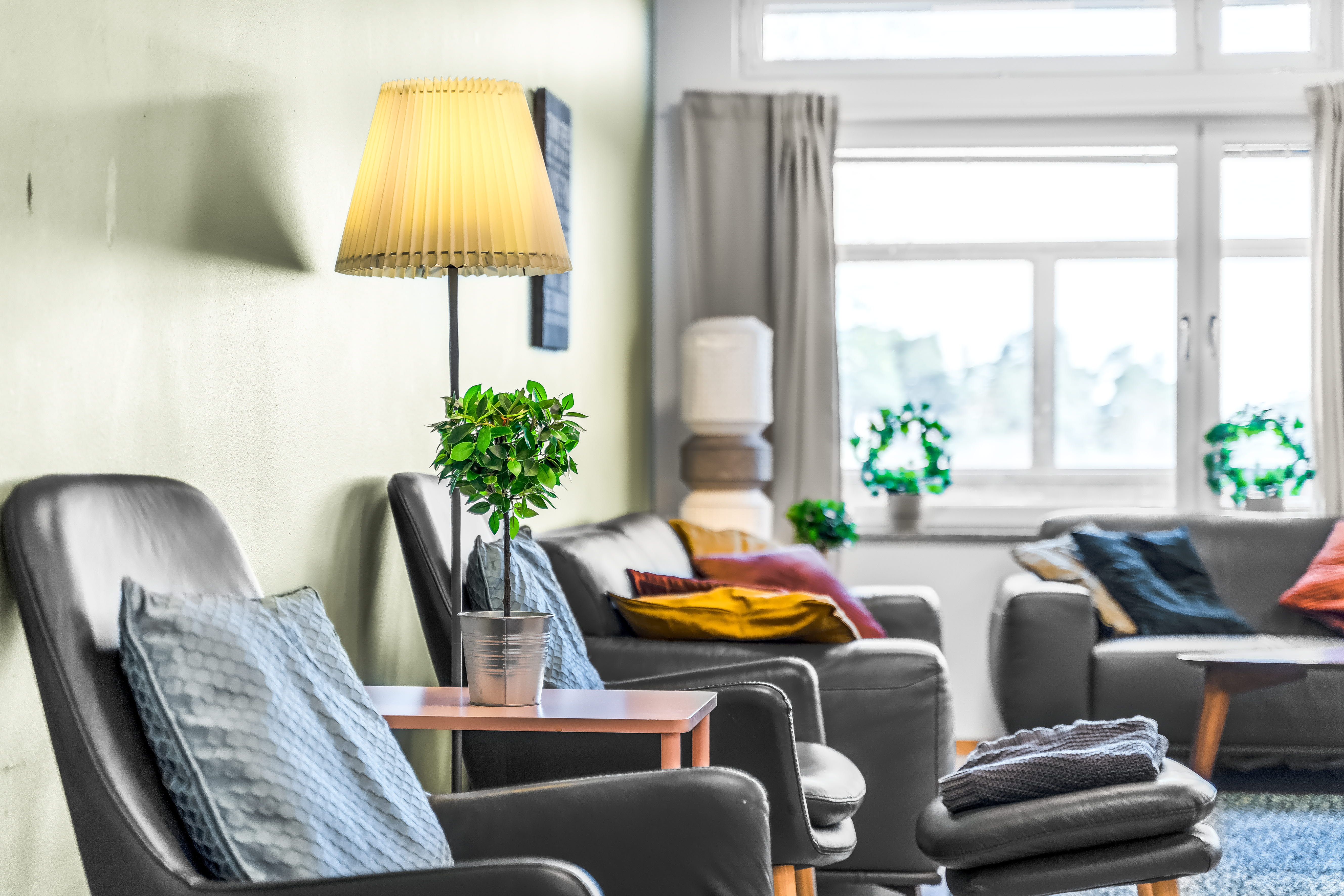 A living room filled with furniture and a large window