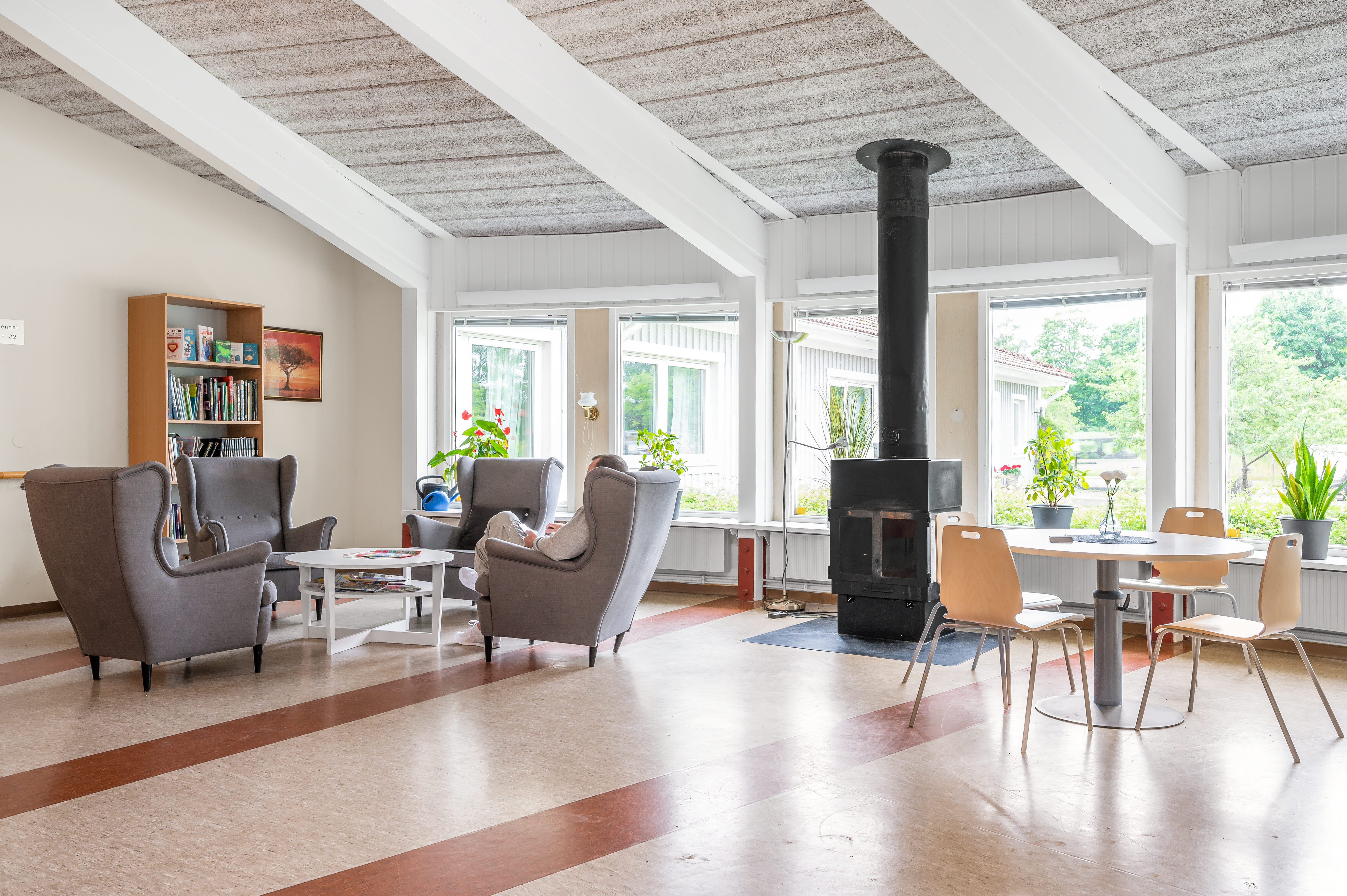 A living room filled with furniture and a large window
