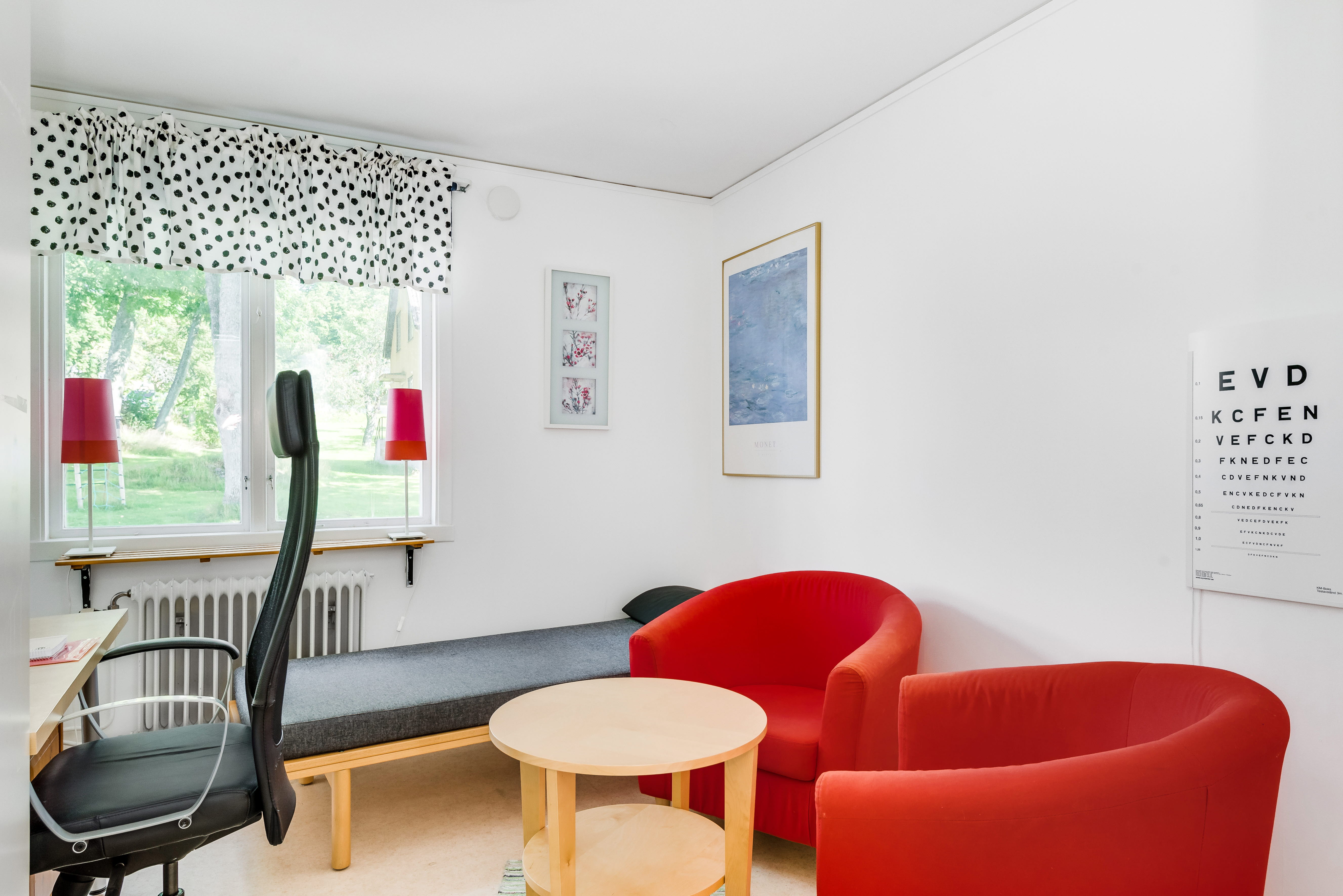 A living room filled with furniture and a large window