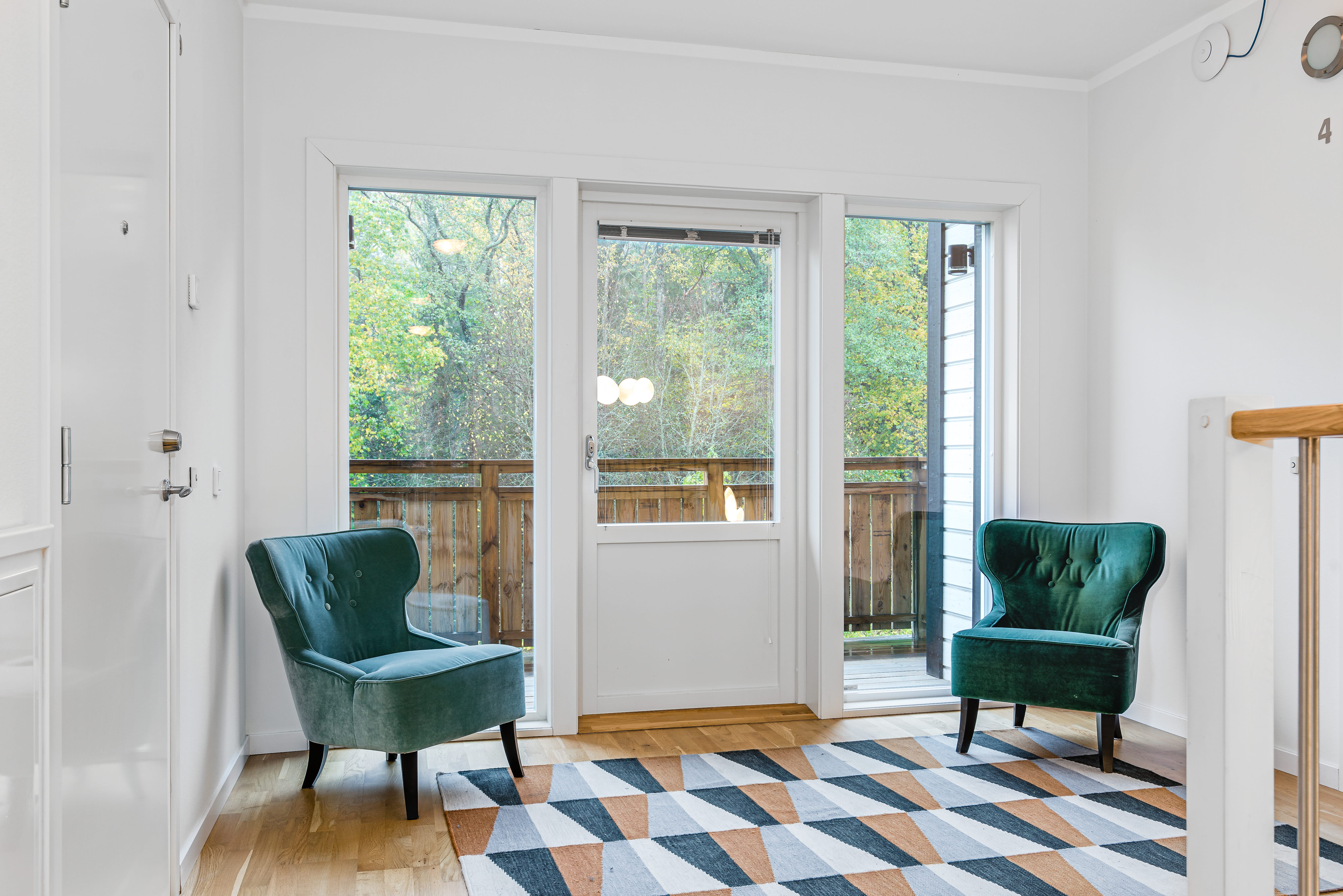A living room filled with furniture and a large window