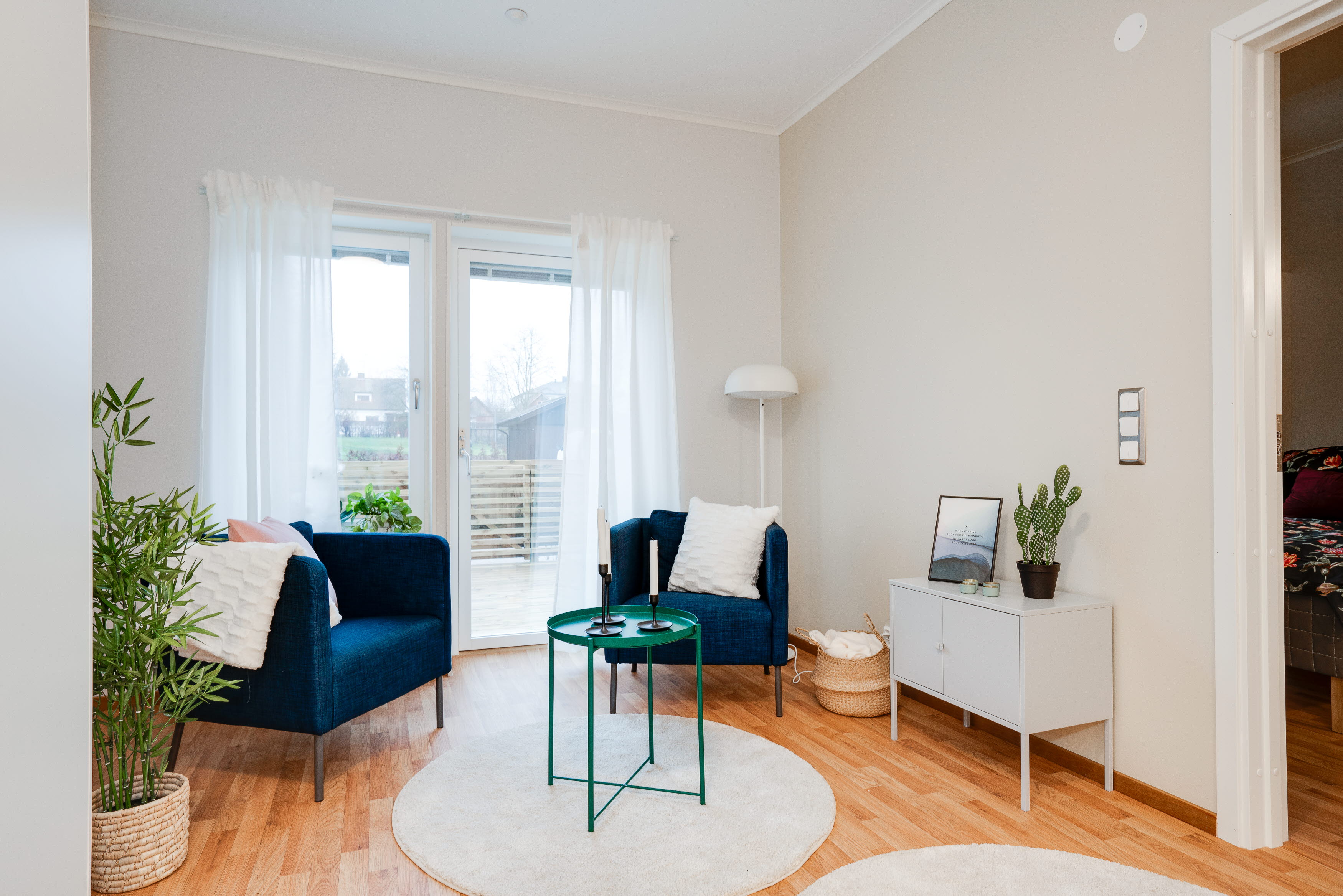 A living room filled with furniture and a large window