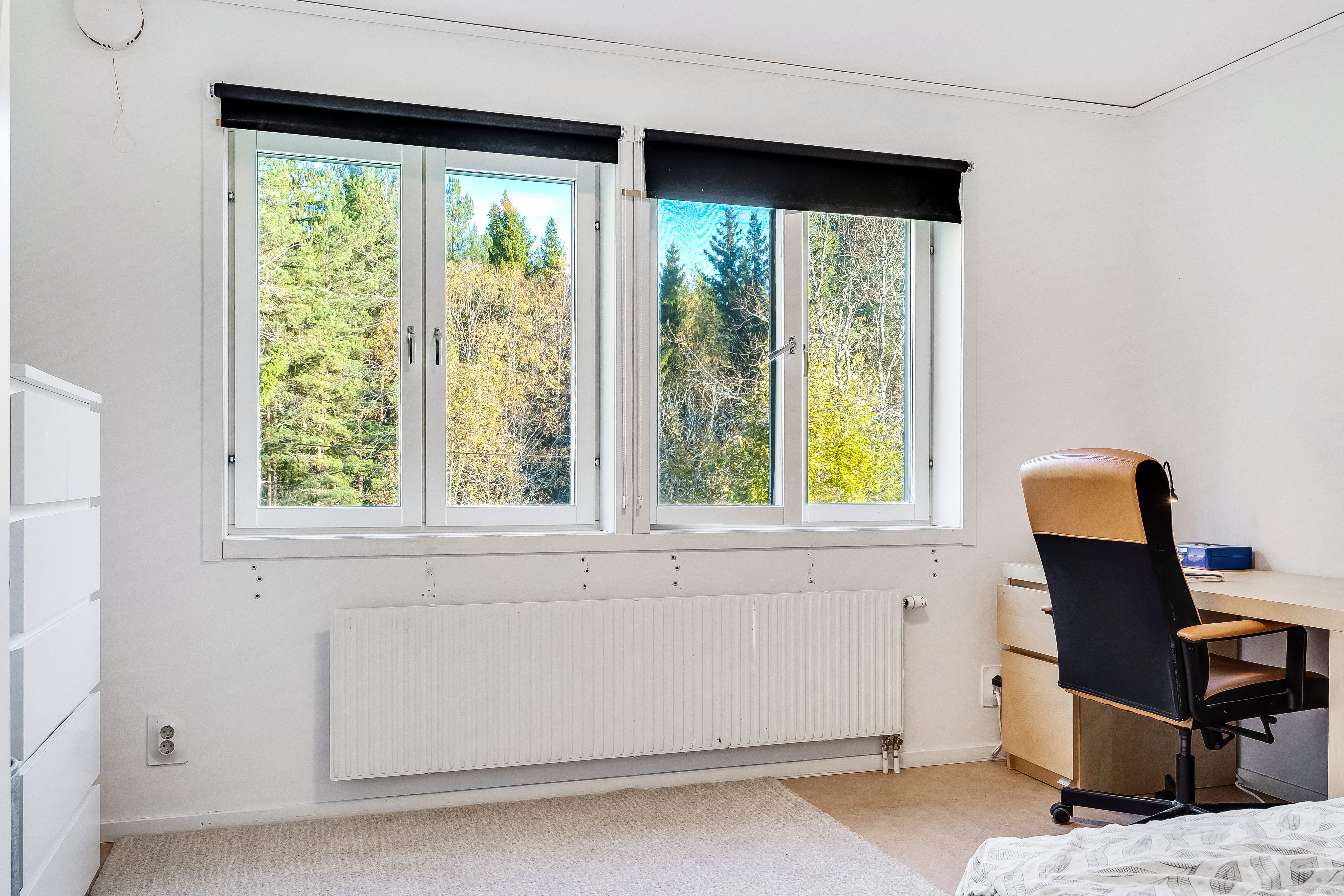 A living room filled with furniture and a large window