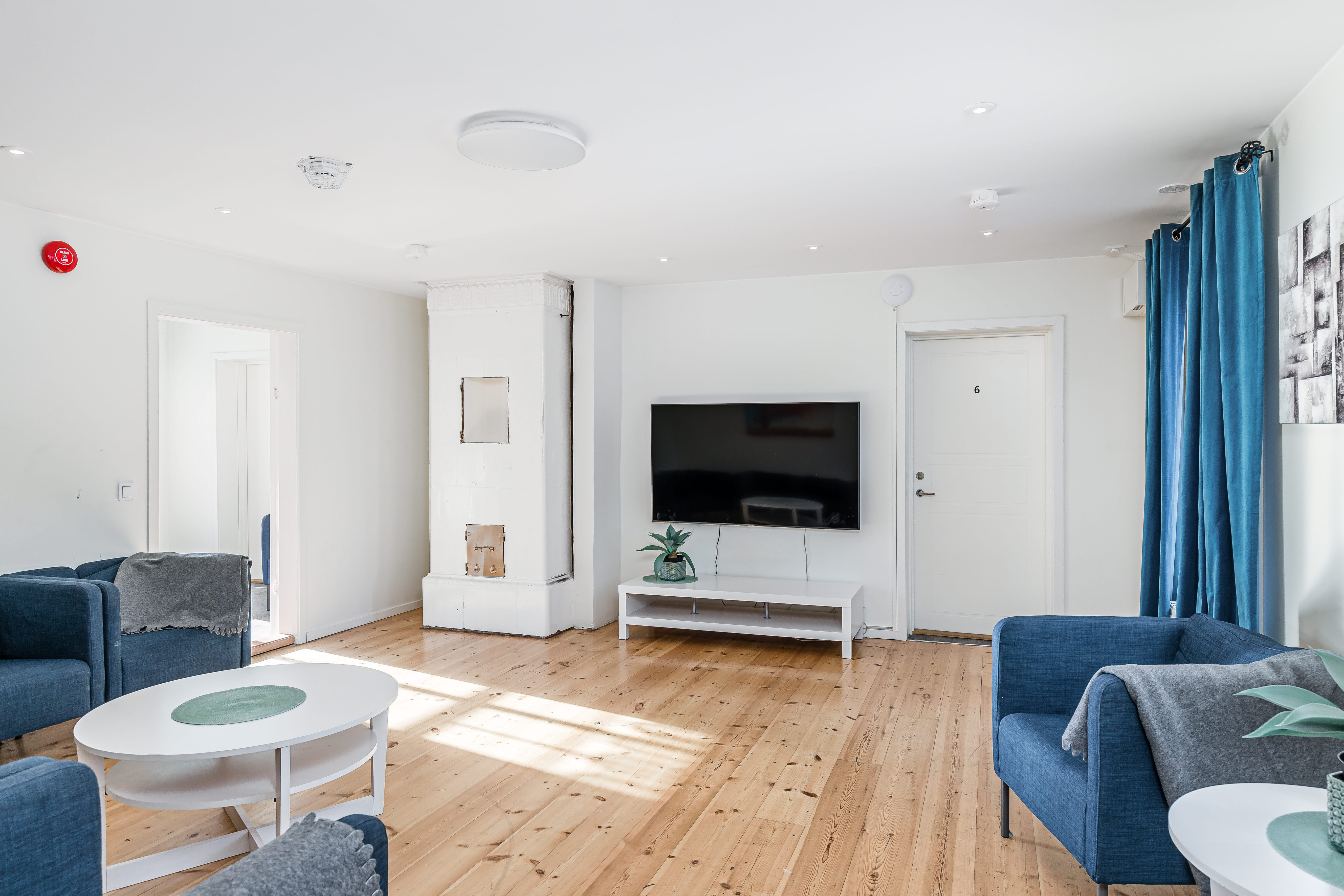 A living room filled with furniture and a tv