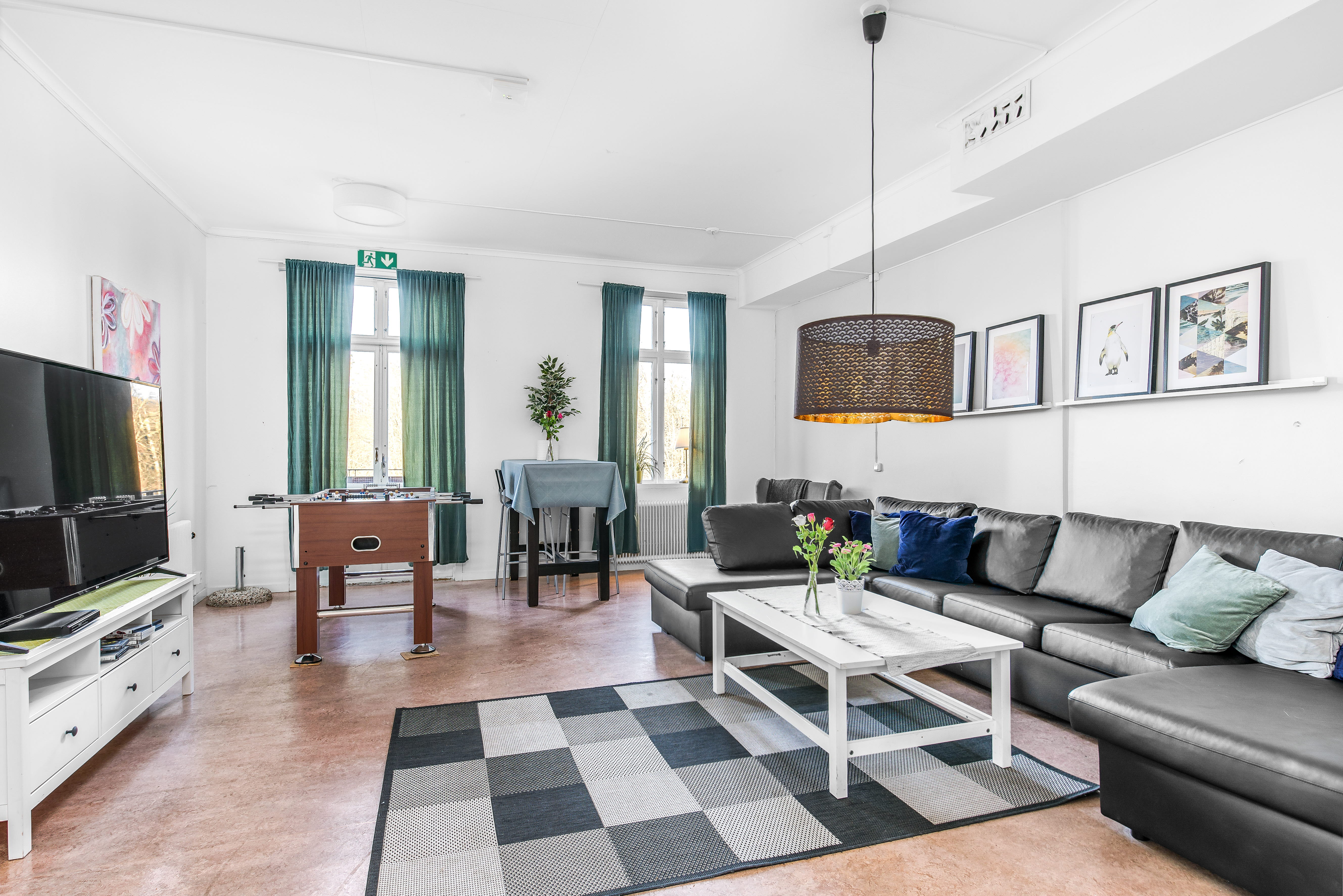 A living room filled with furniture and a flat screen tv