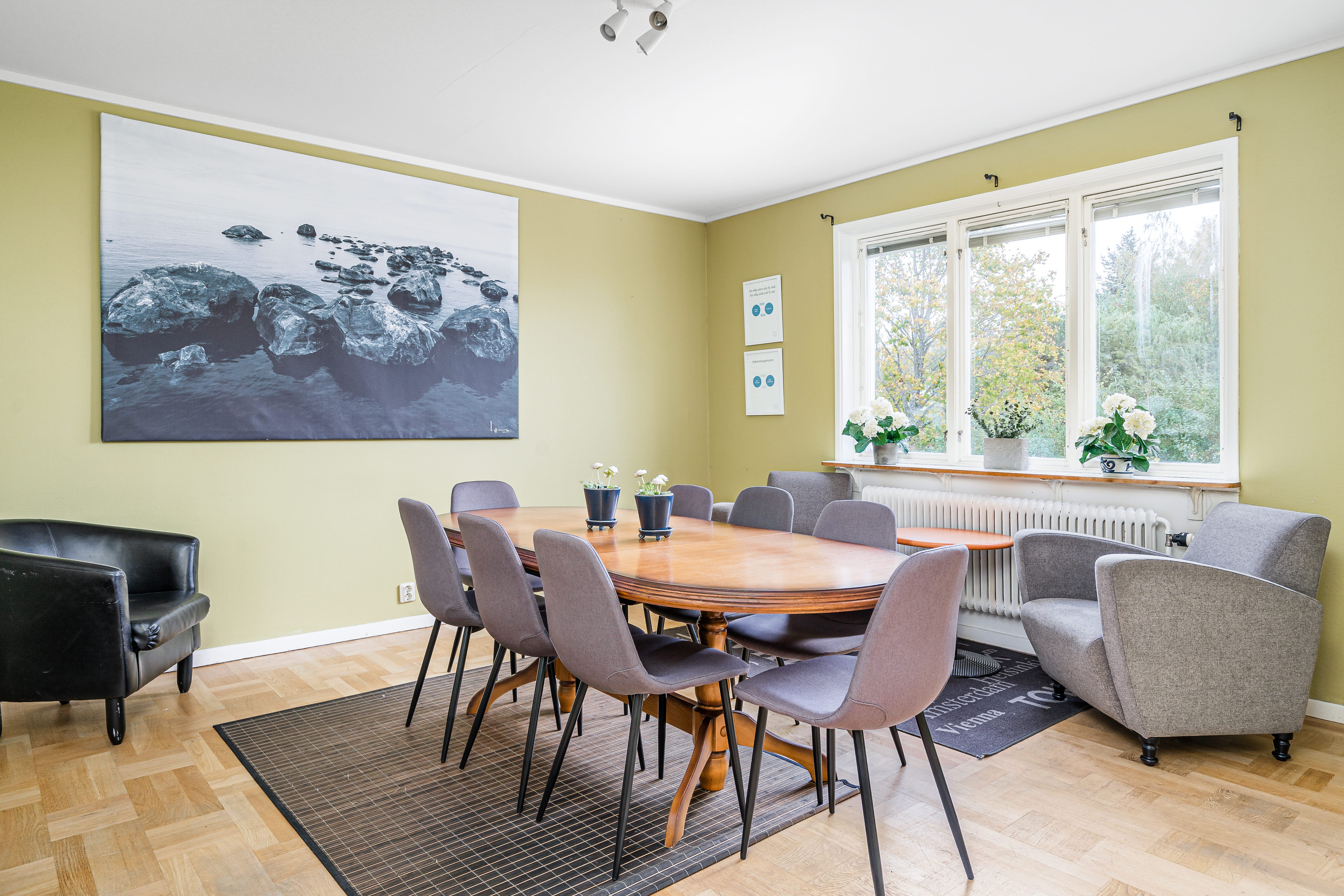 A living room filled with furniture and a large window
