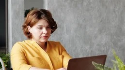 A woman sitting at a desk 