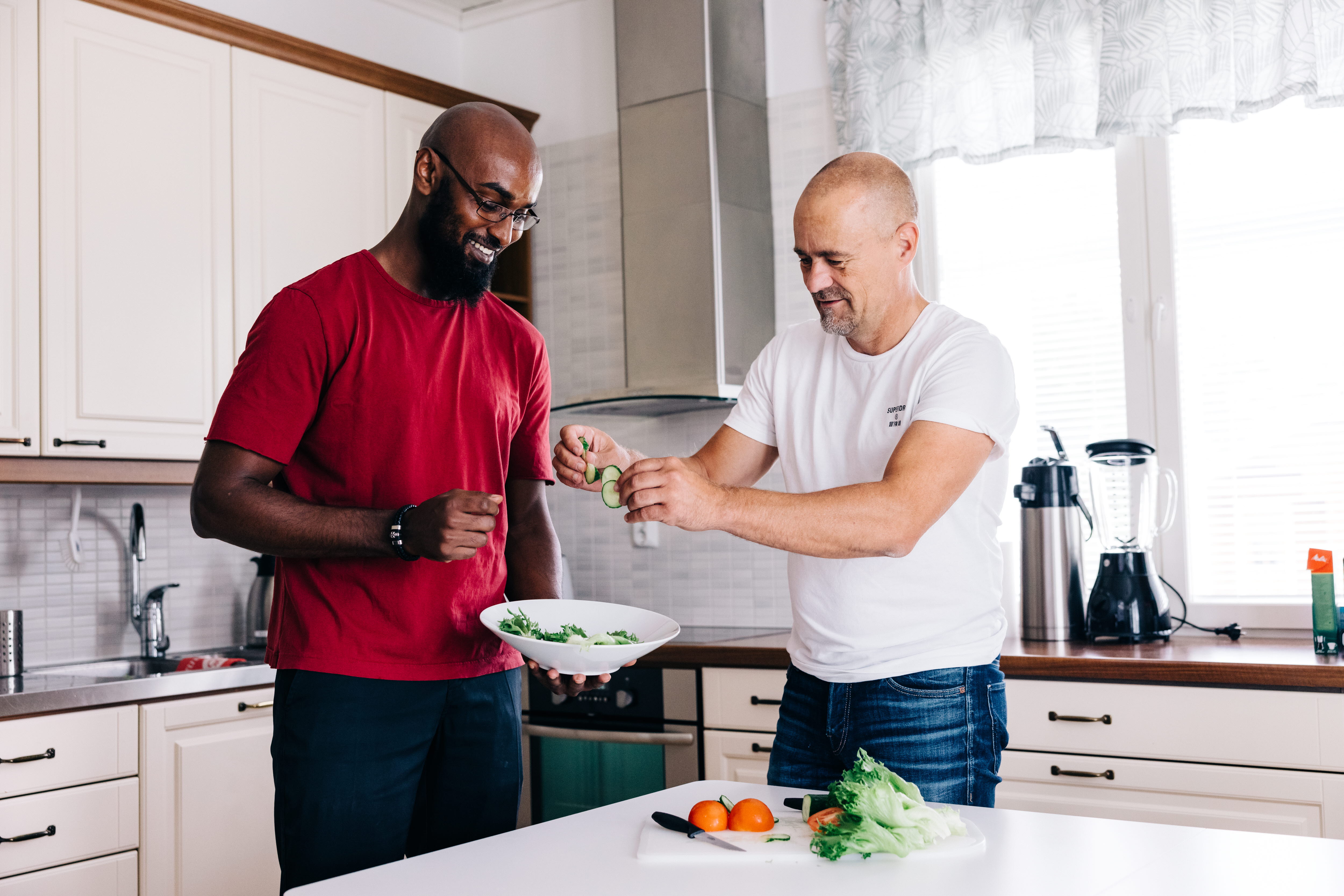 A person standing on a kitchen counter preparing food
