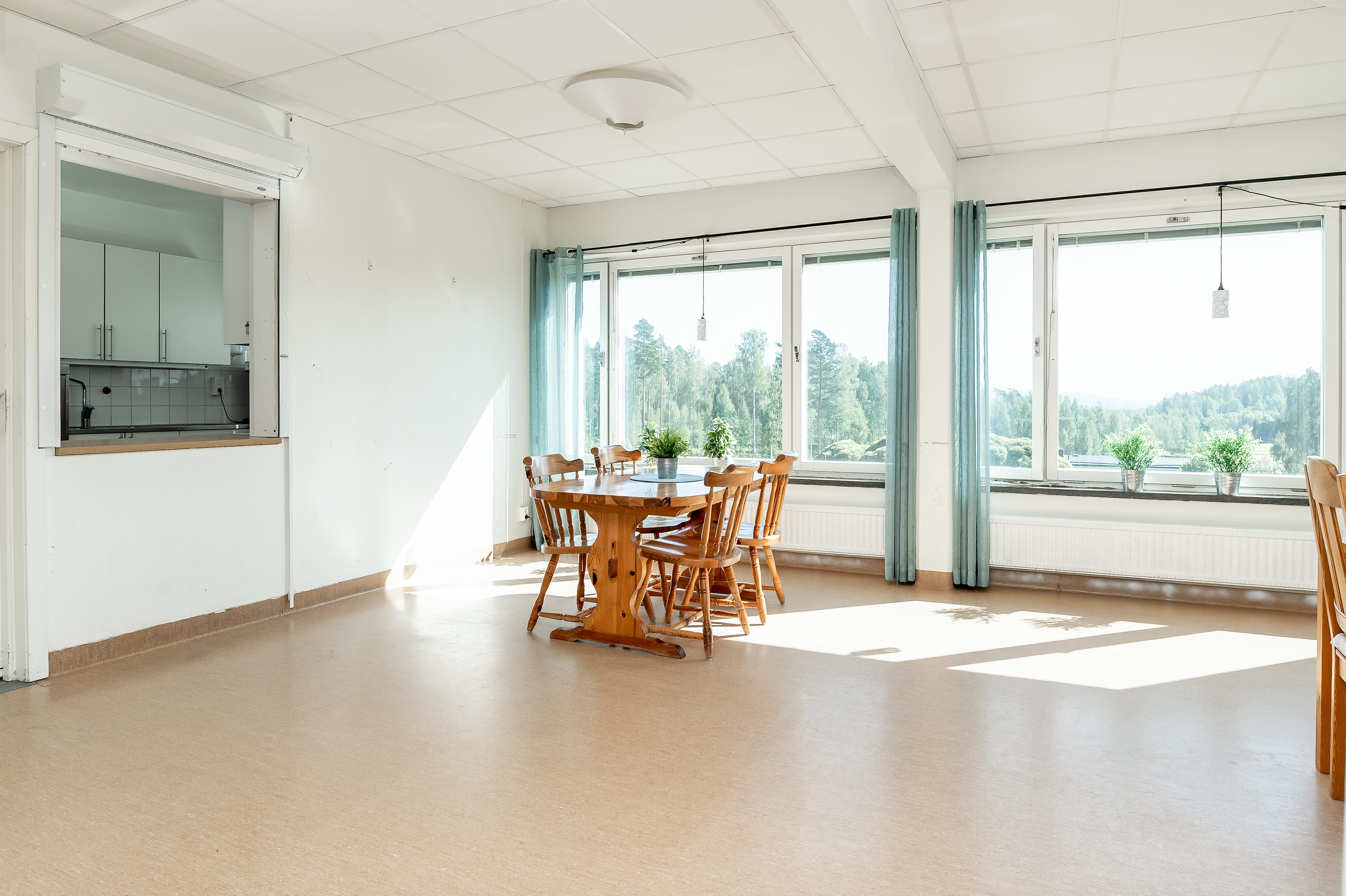A room filled with furniture and a large window