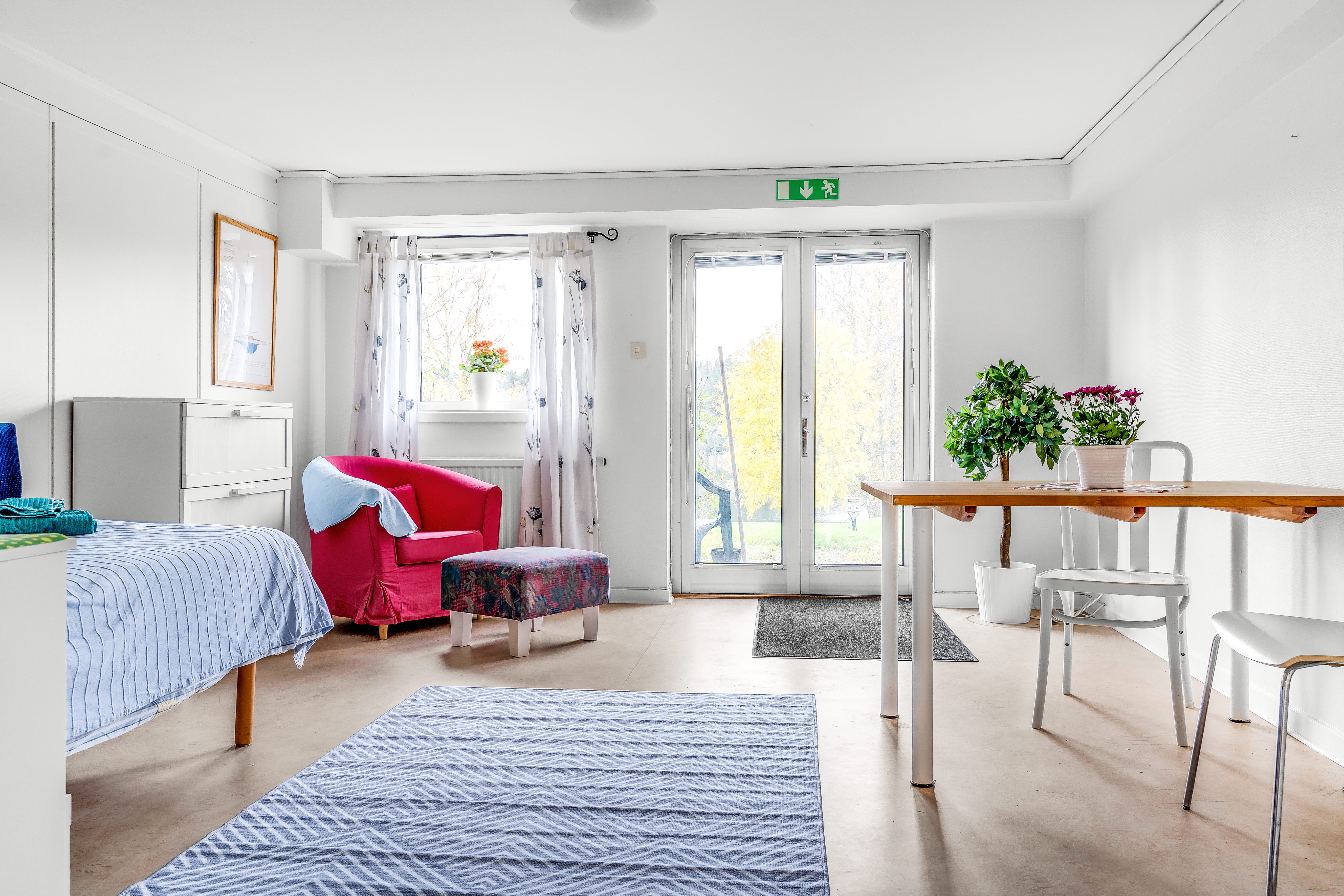 A bedroom with a bed in a room