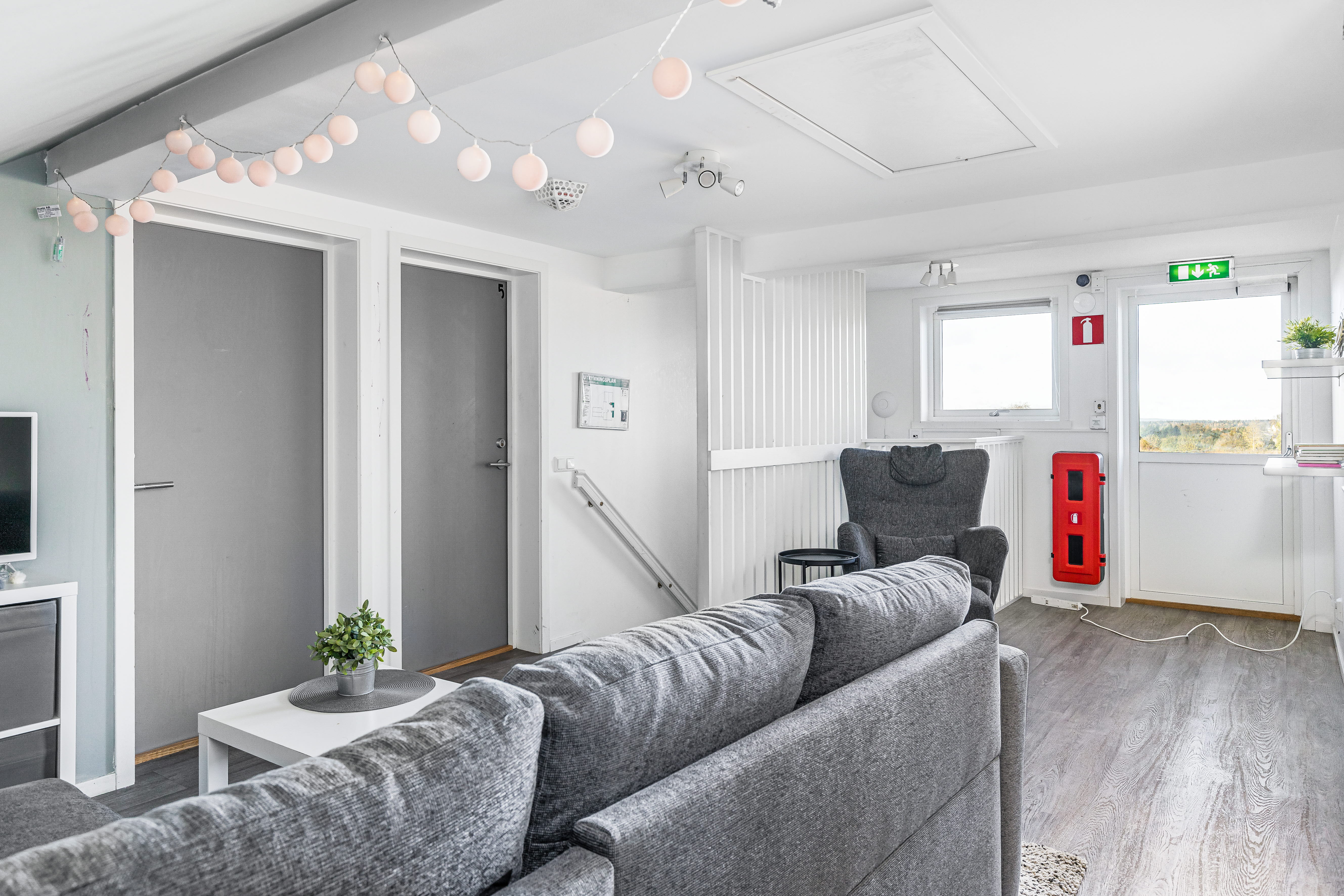 A living room filled with furniture and a flat screen tv