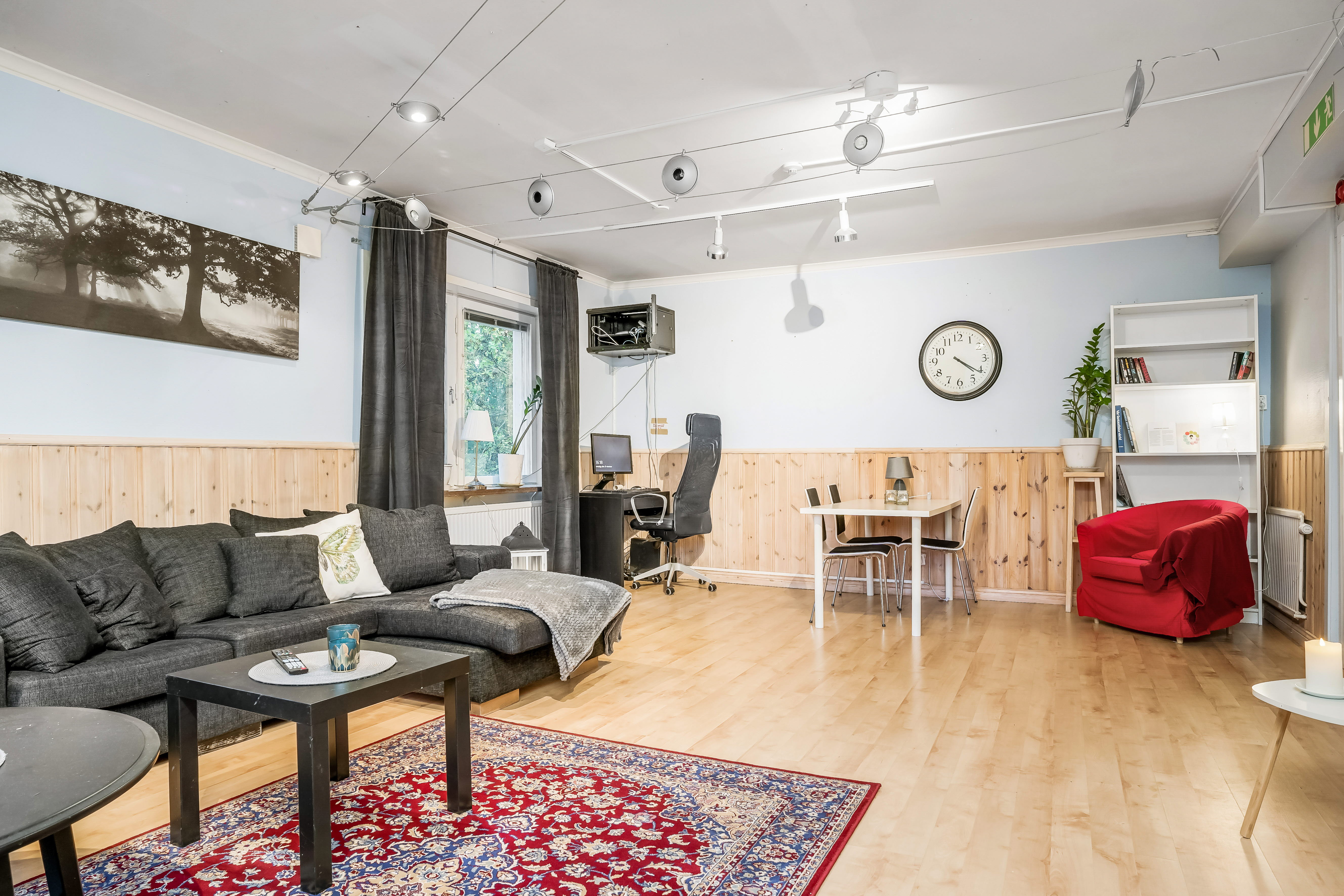 A living room filled with furniture and a large window