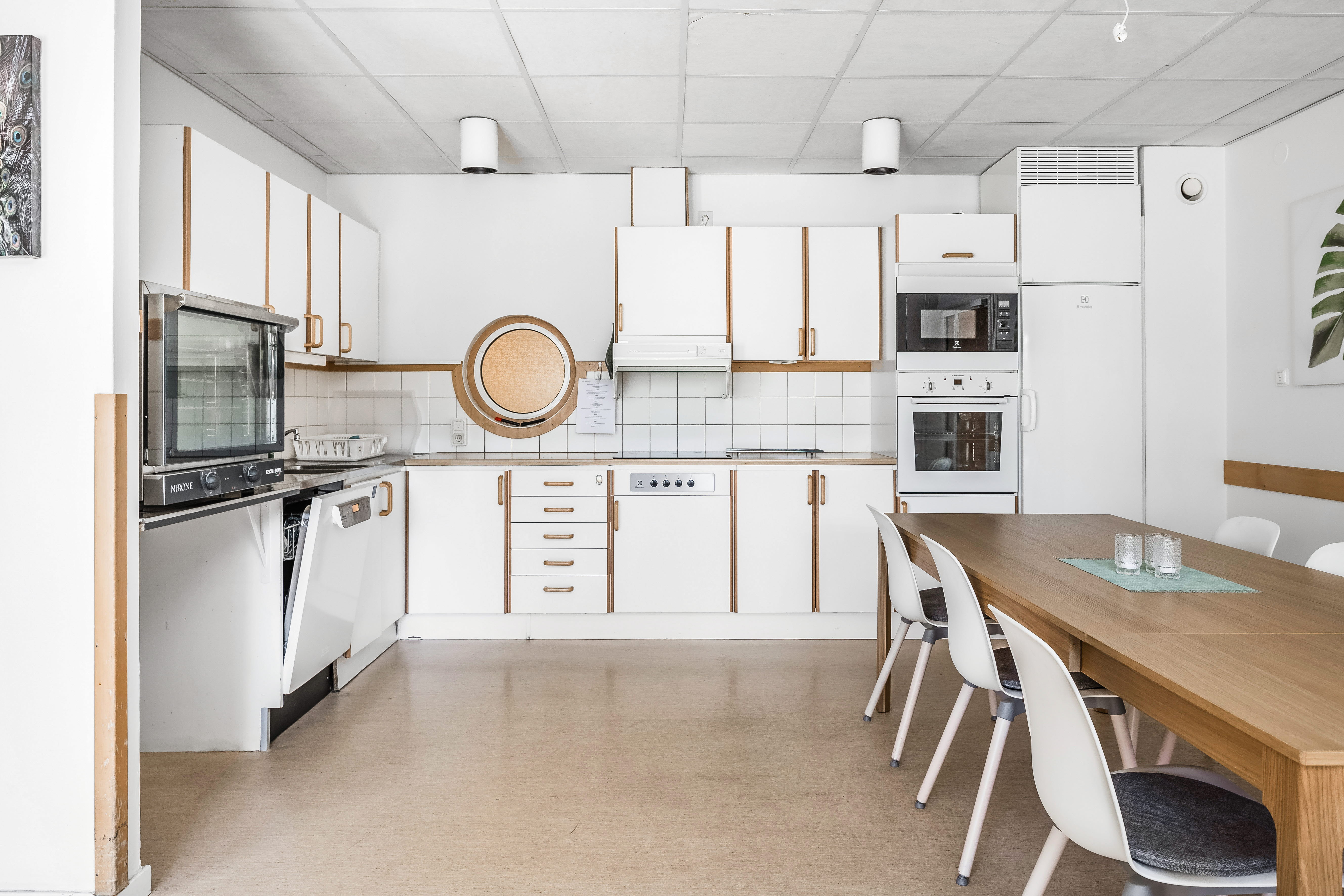 A kitchen with a dining room table