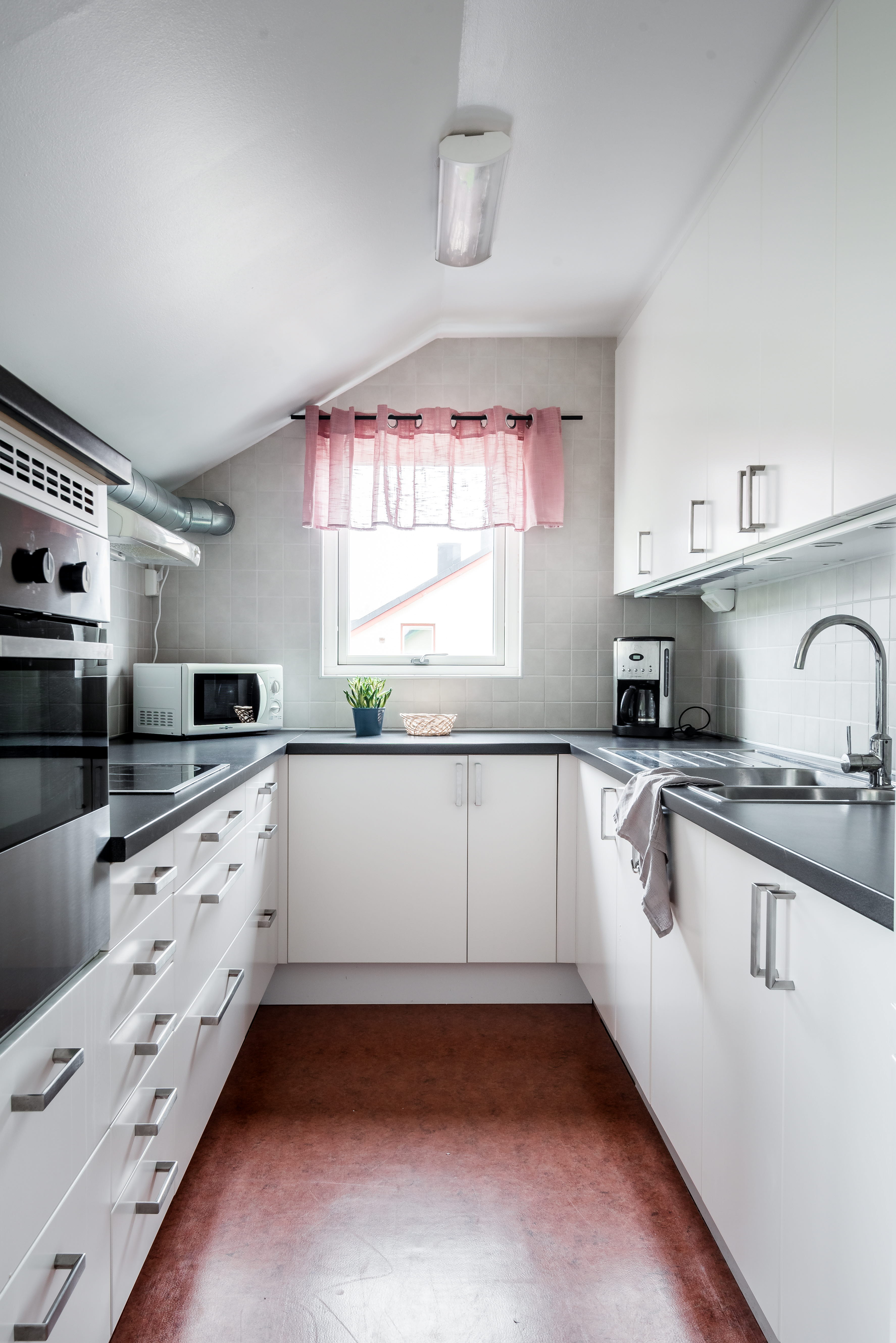 A kitchen with a stove and a sink