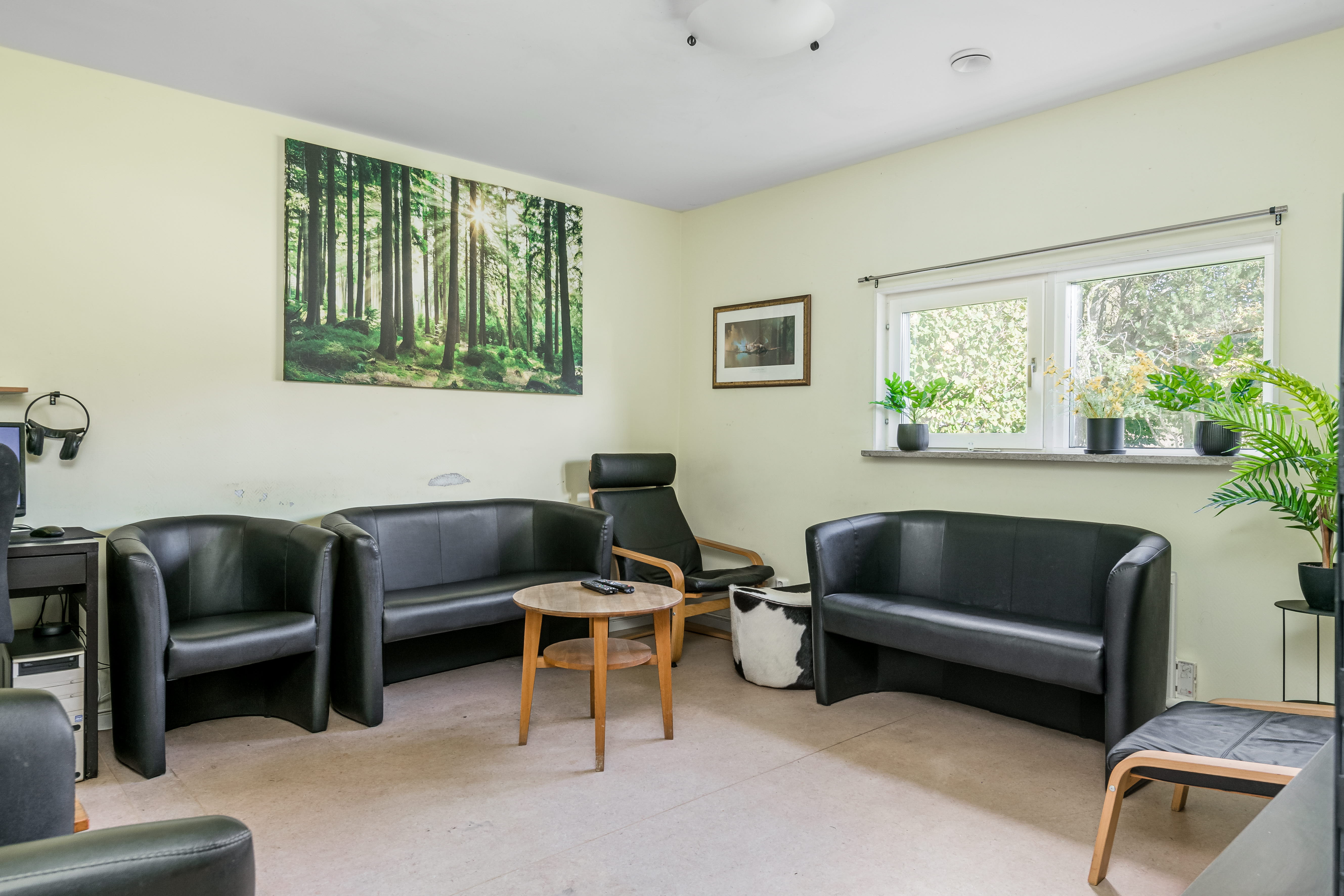 A living room filled with furniture and a large window