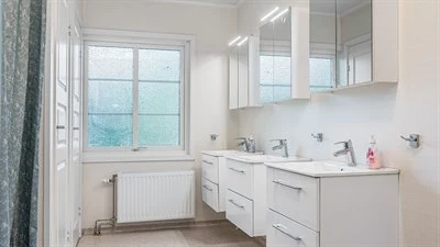 A room with a sink and a window
