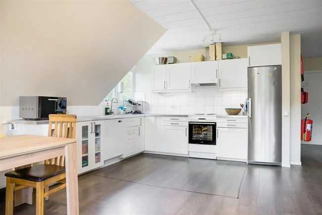 A kitchen with a wood floor