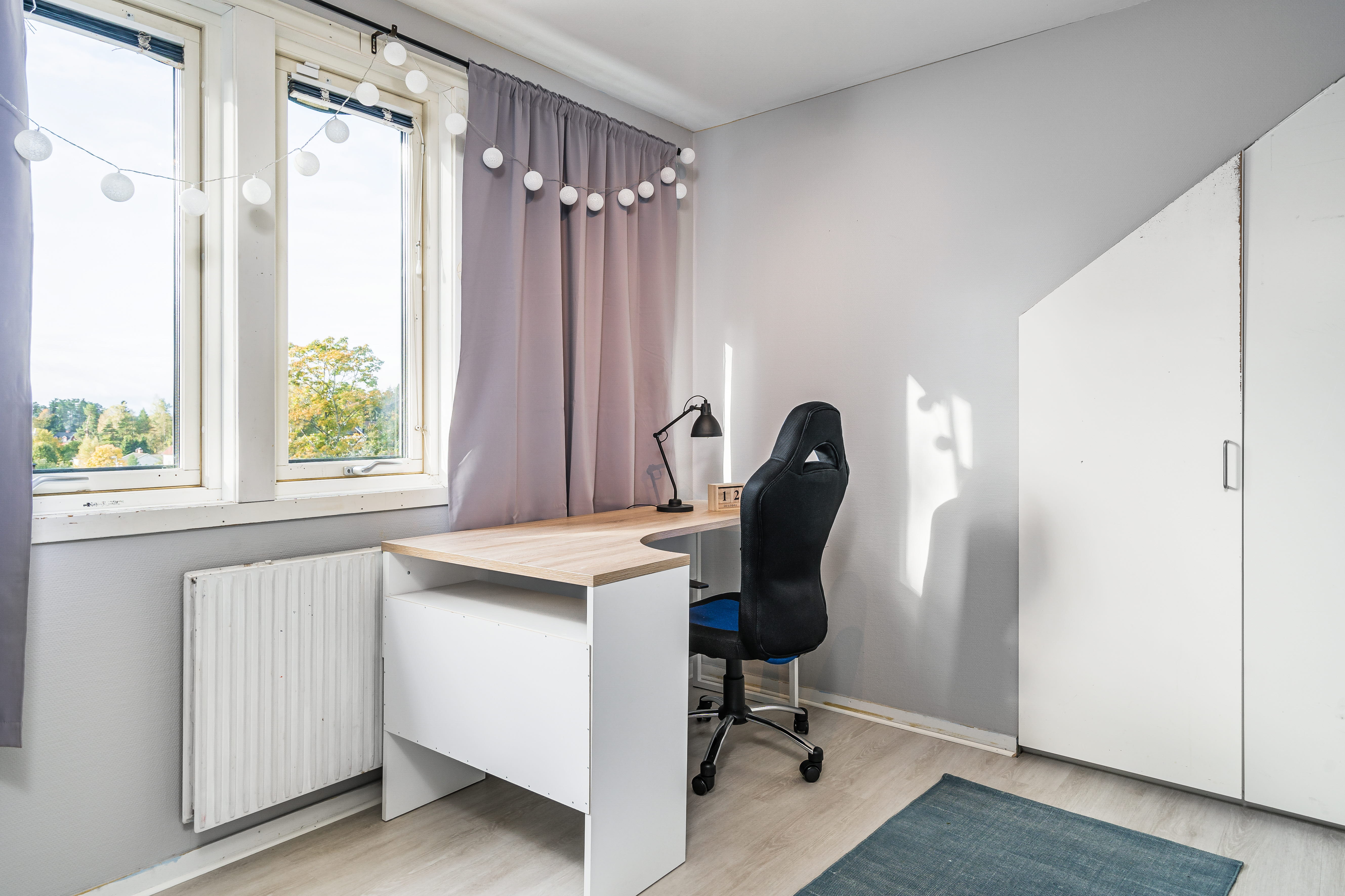 A room filled with furniture and a large window