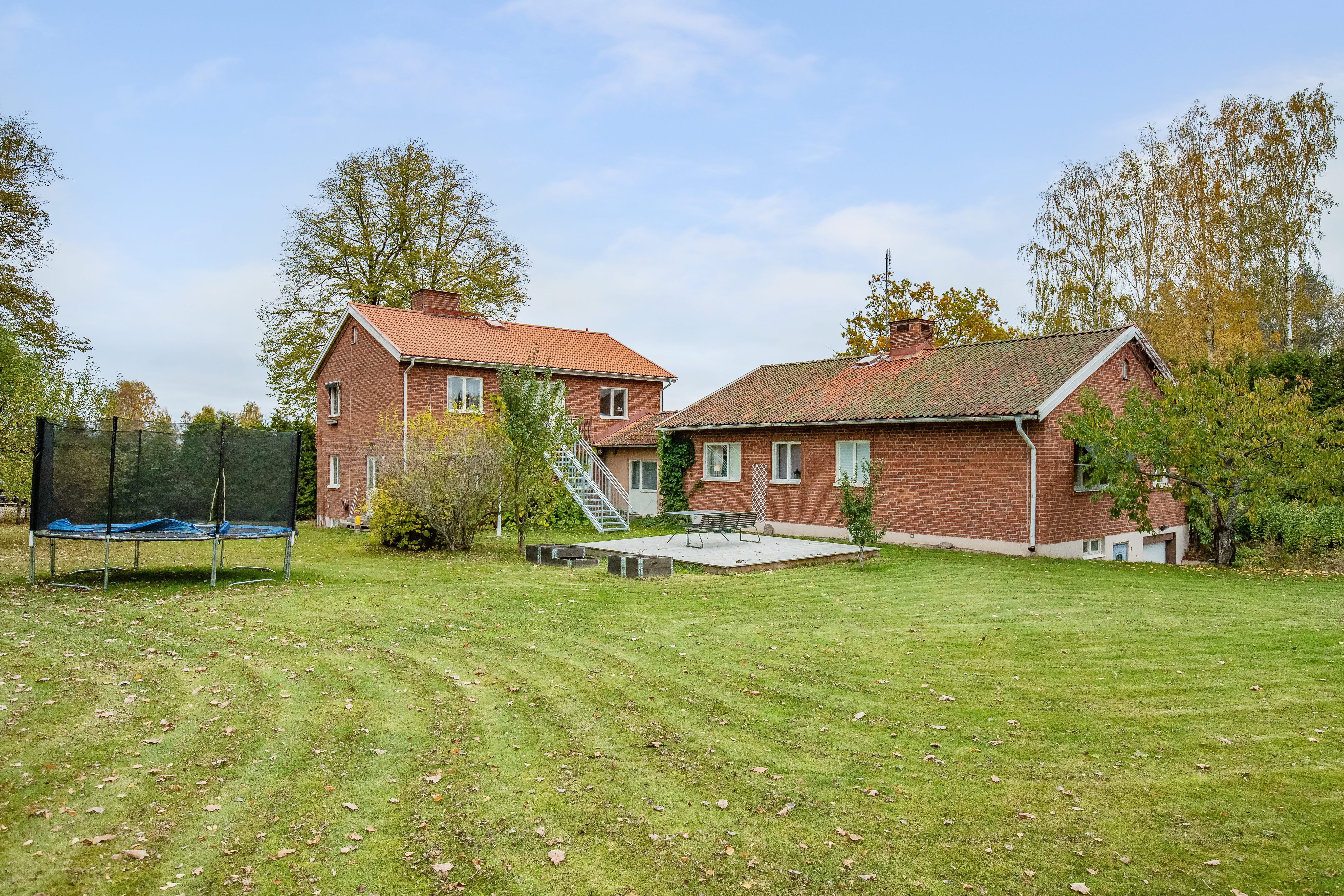 A house on top of a lush green field