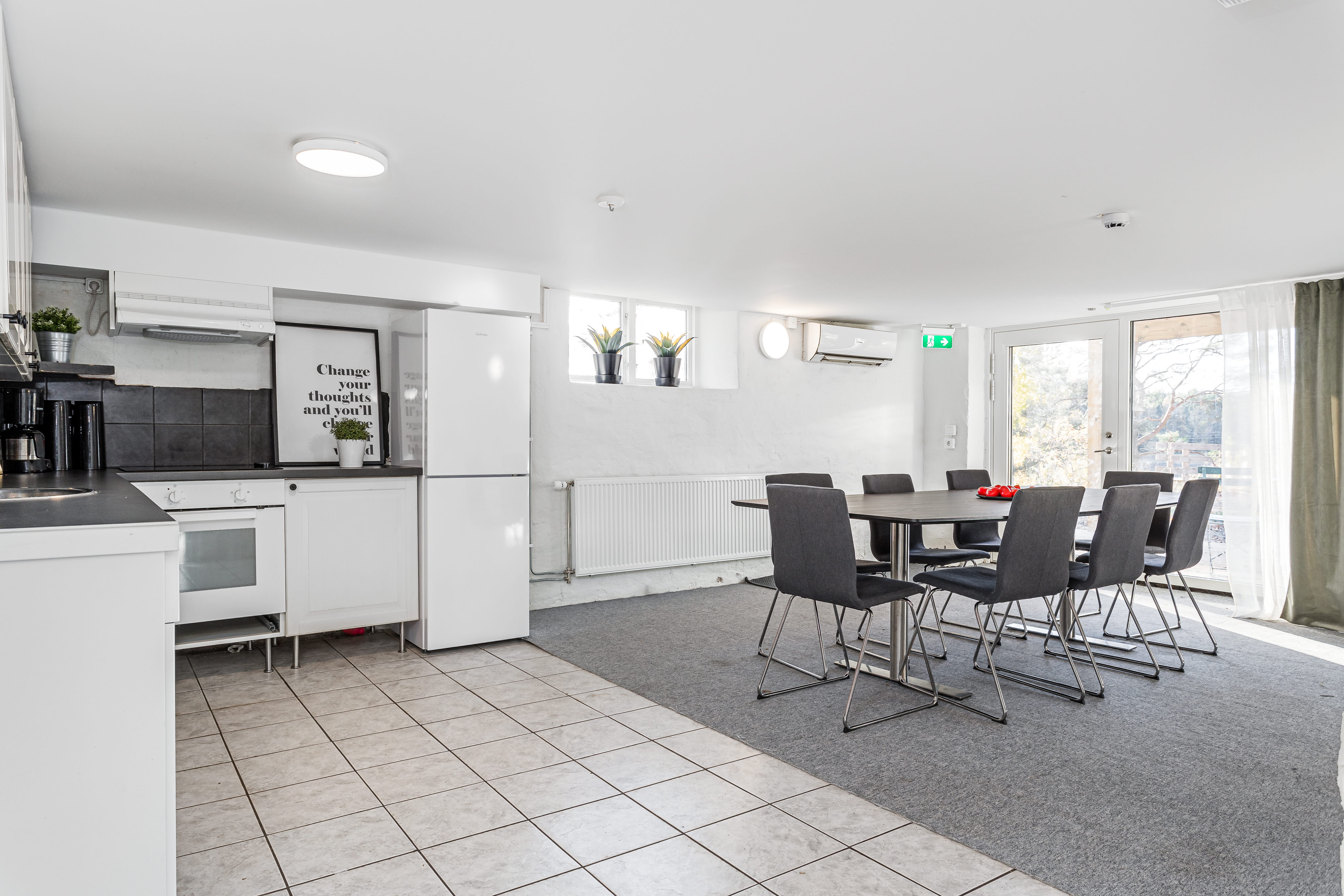 A kitchen filled with lots of furniture