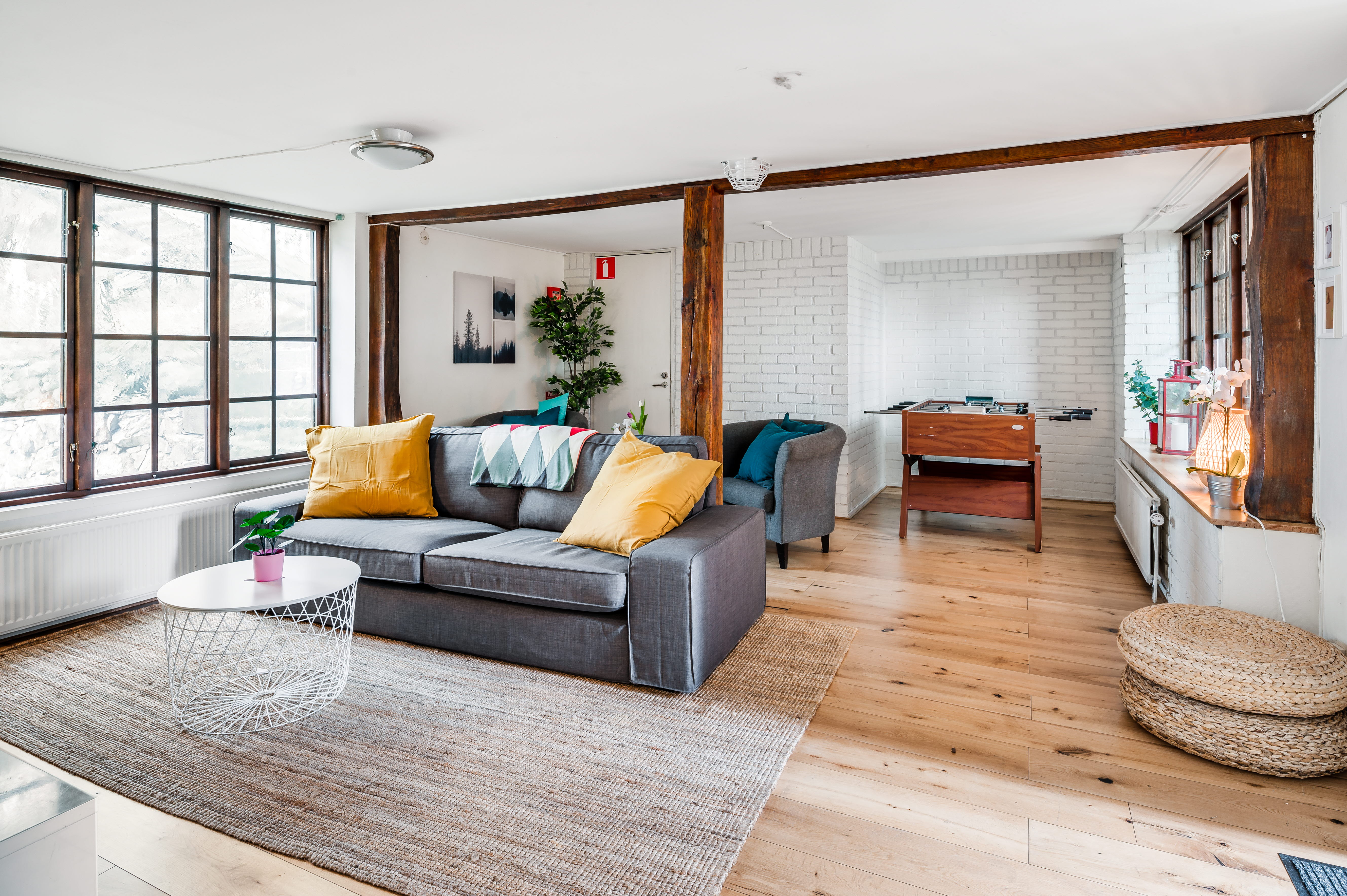 A living room filled with furniture and a large window