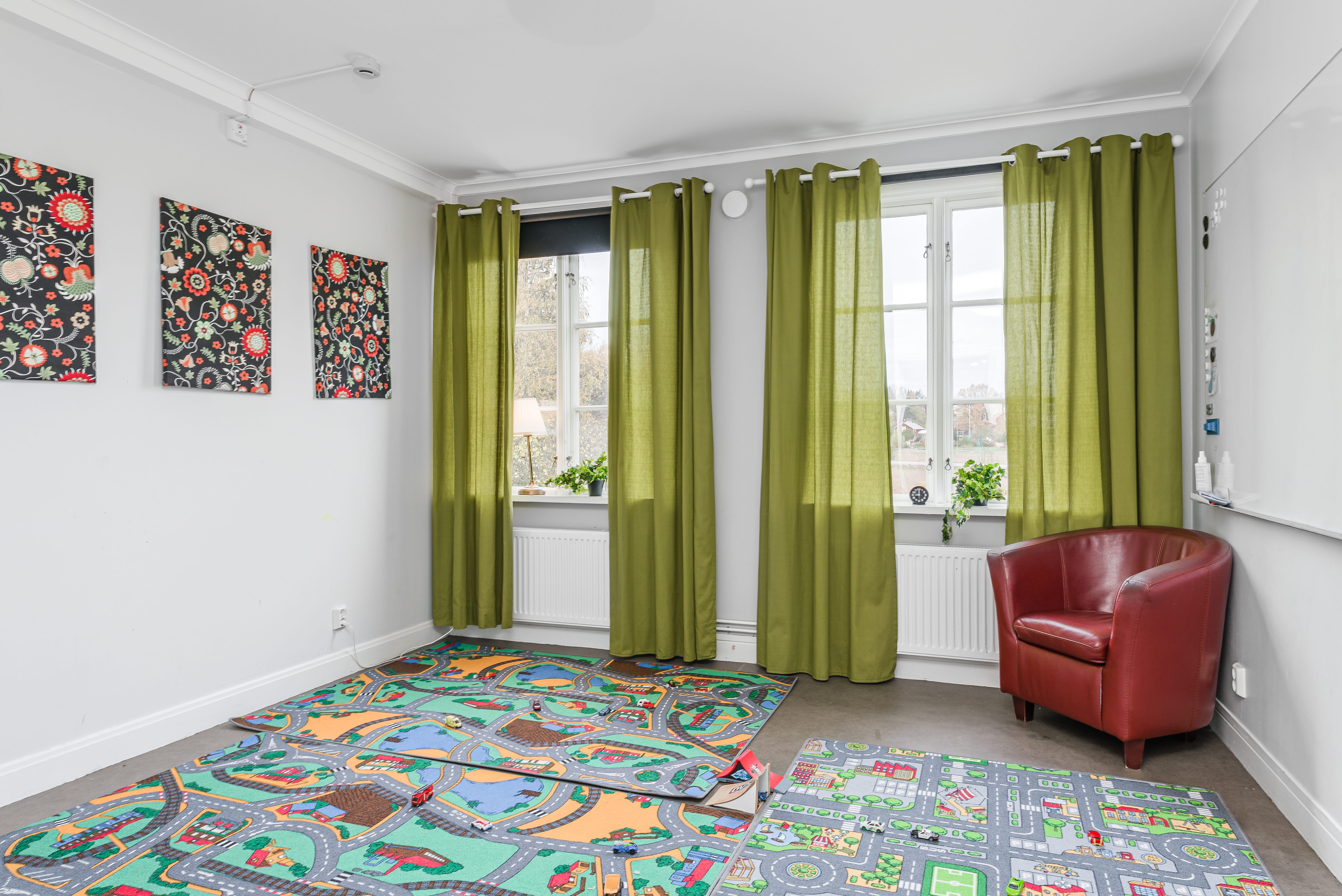 A room filled with furniture and a large window
