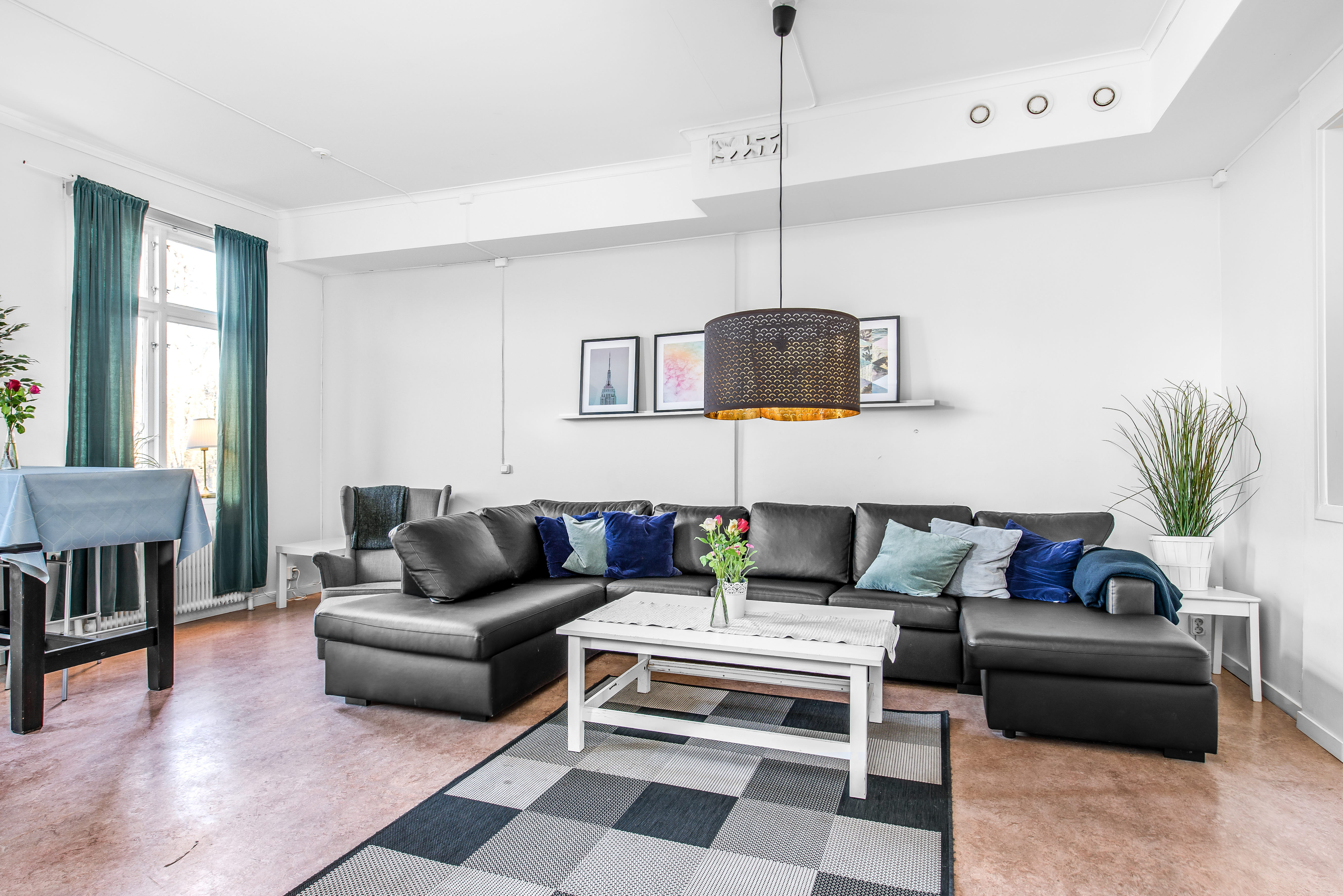 A living room filled with furniture and a large window