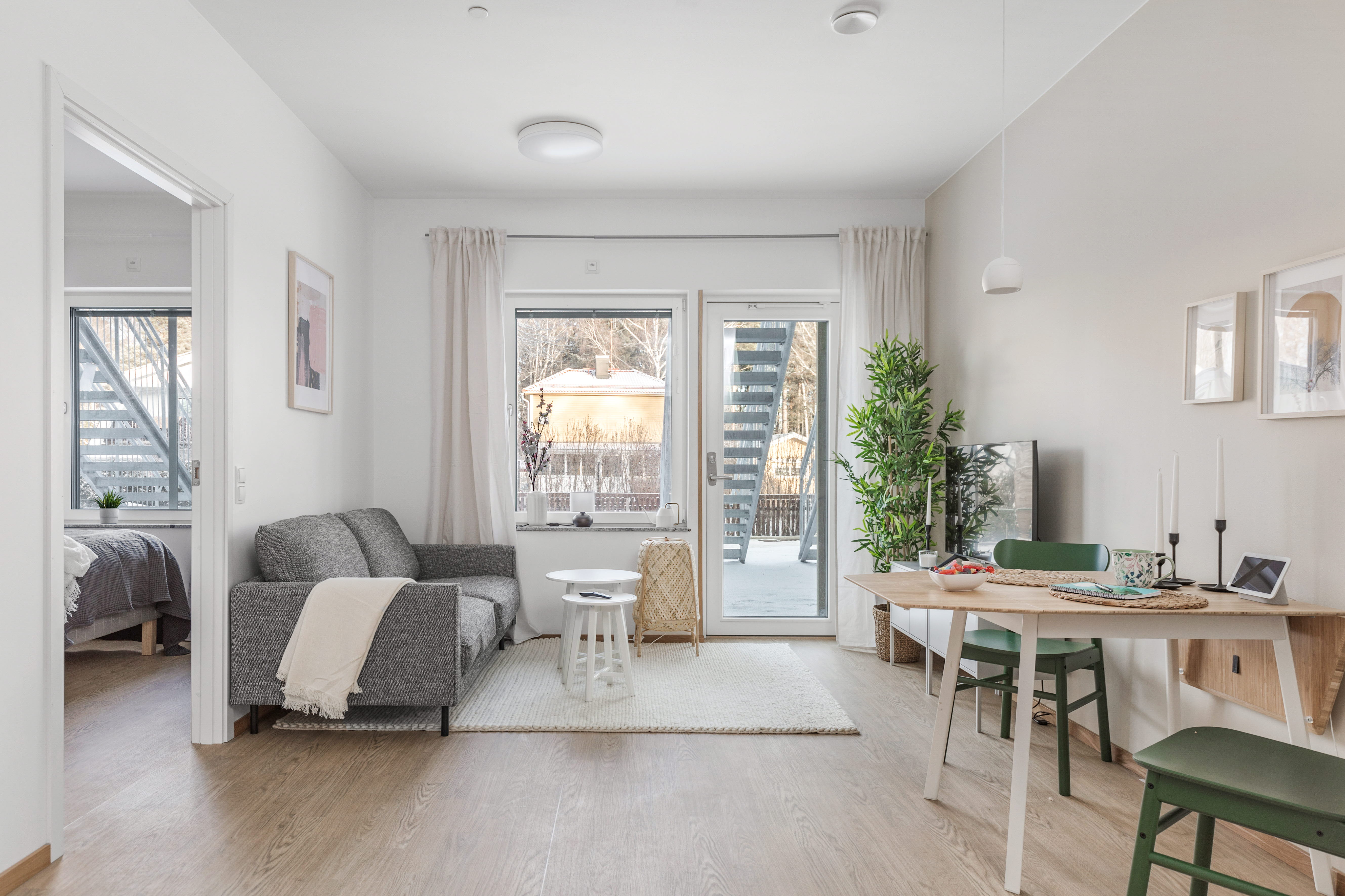 A living room filled with furniture and a large window