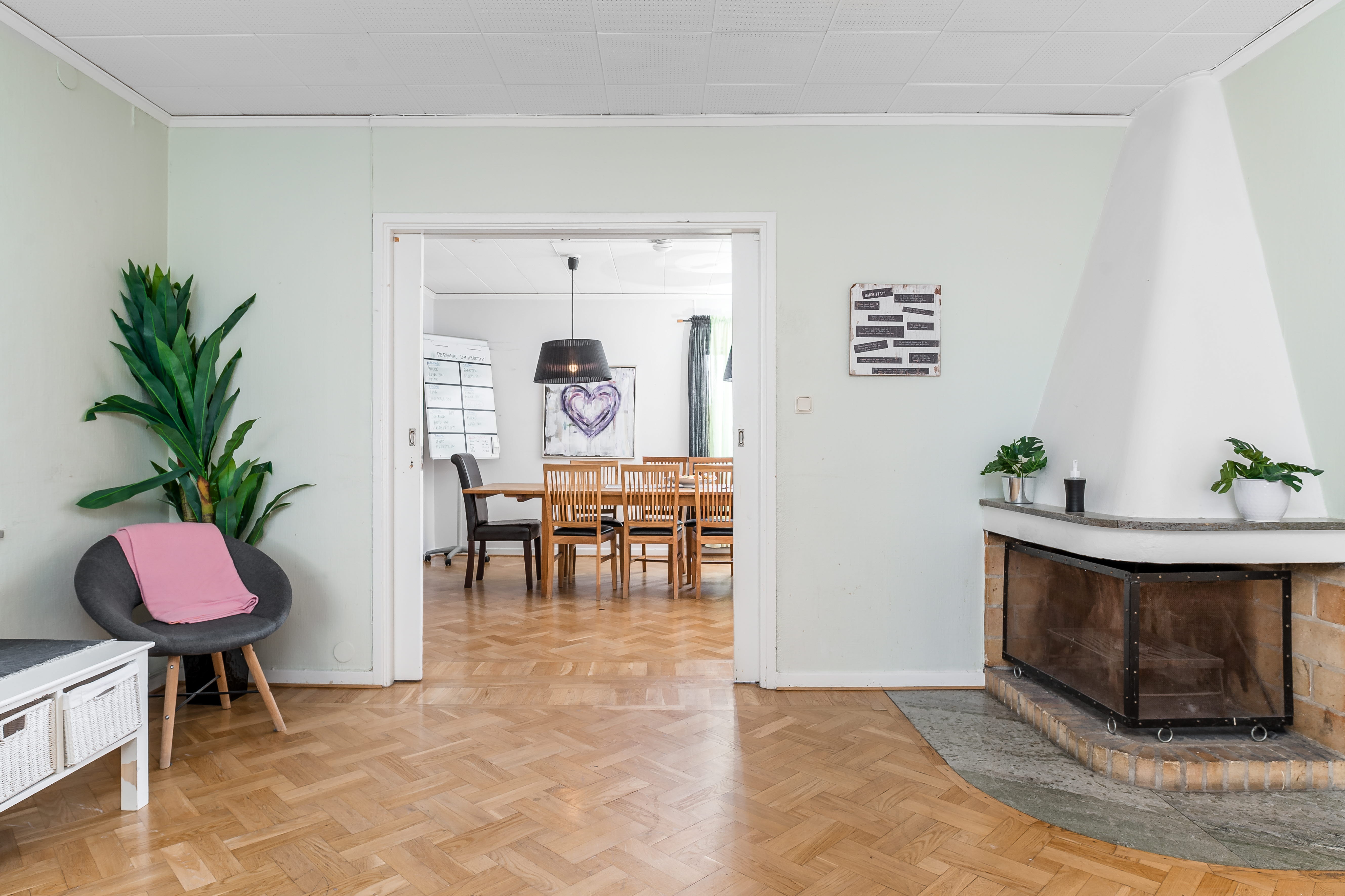 A living room filled with furniture on top of a hard wood floor
