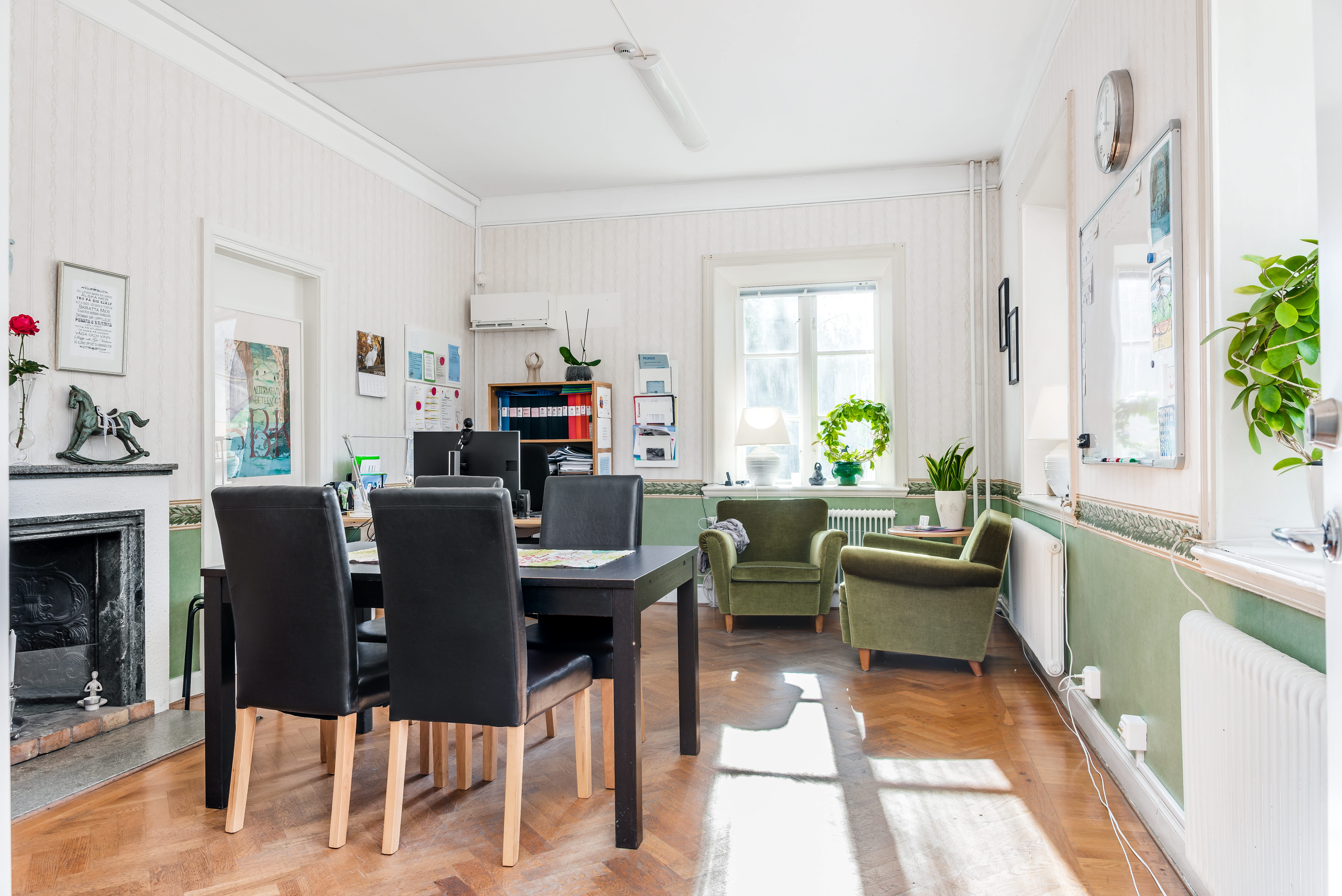 A living room filled with furniture and a wood floor